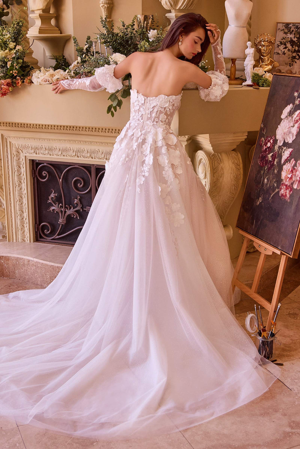 Off-white strapless wedding gown with floral bodice, long skirt, and lace sleeves