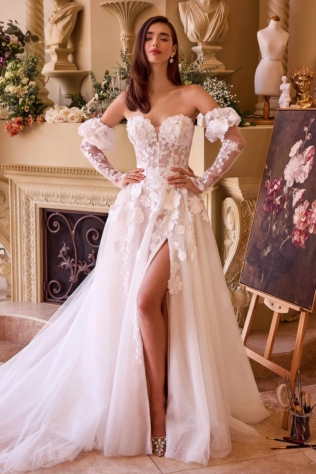 Strapless off-white wedding gown with floral lace appliques and puffed sleeves