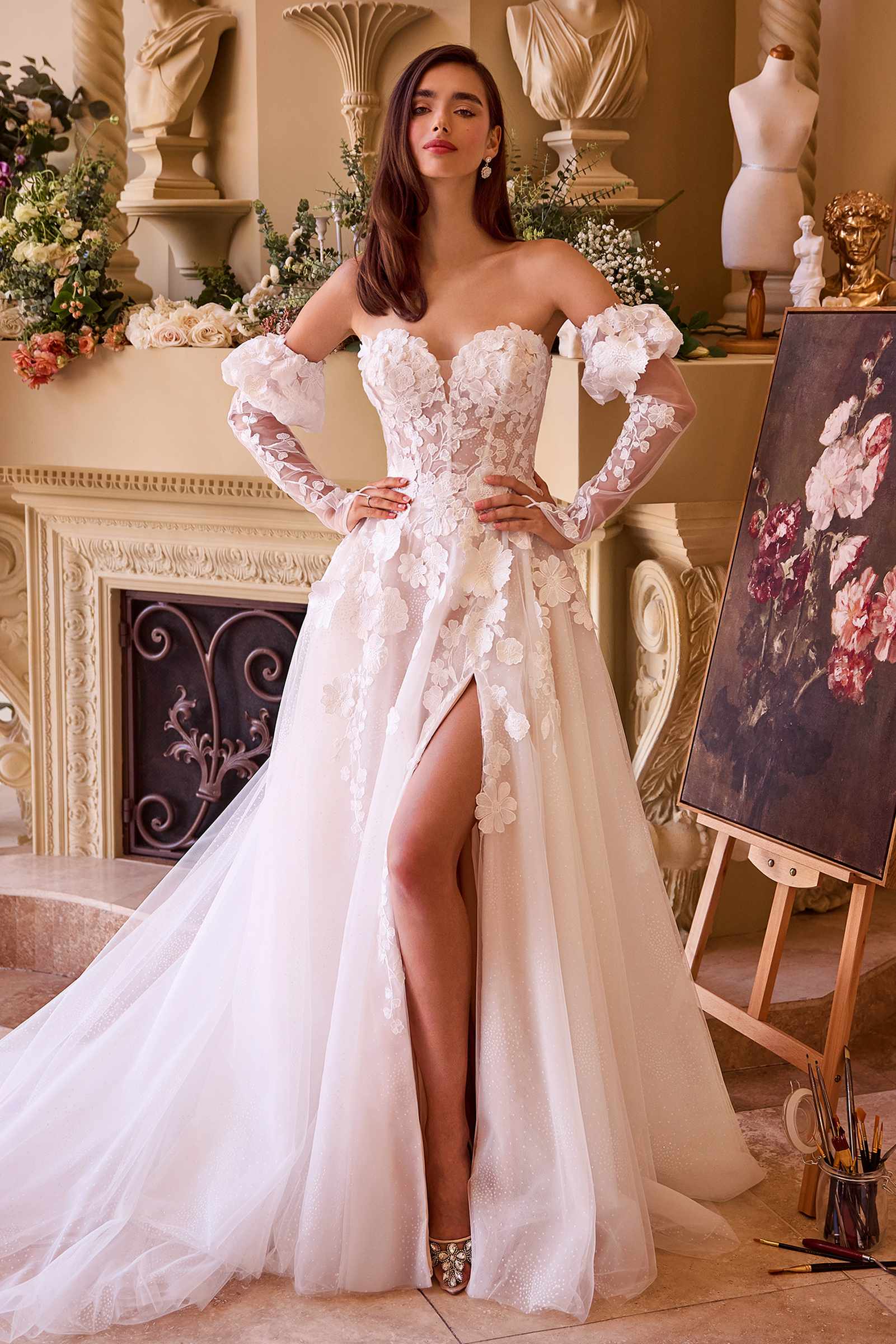 Strapless off-white wedding gown with floral lace appliques and puffed sleeves