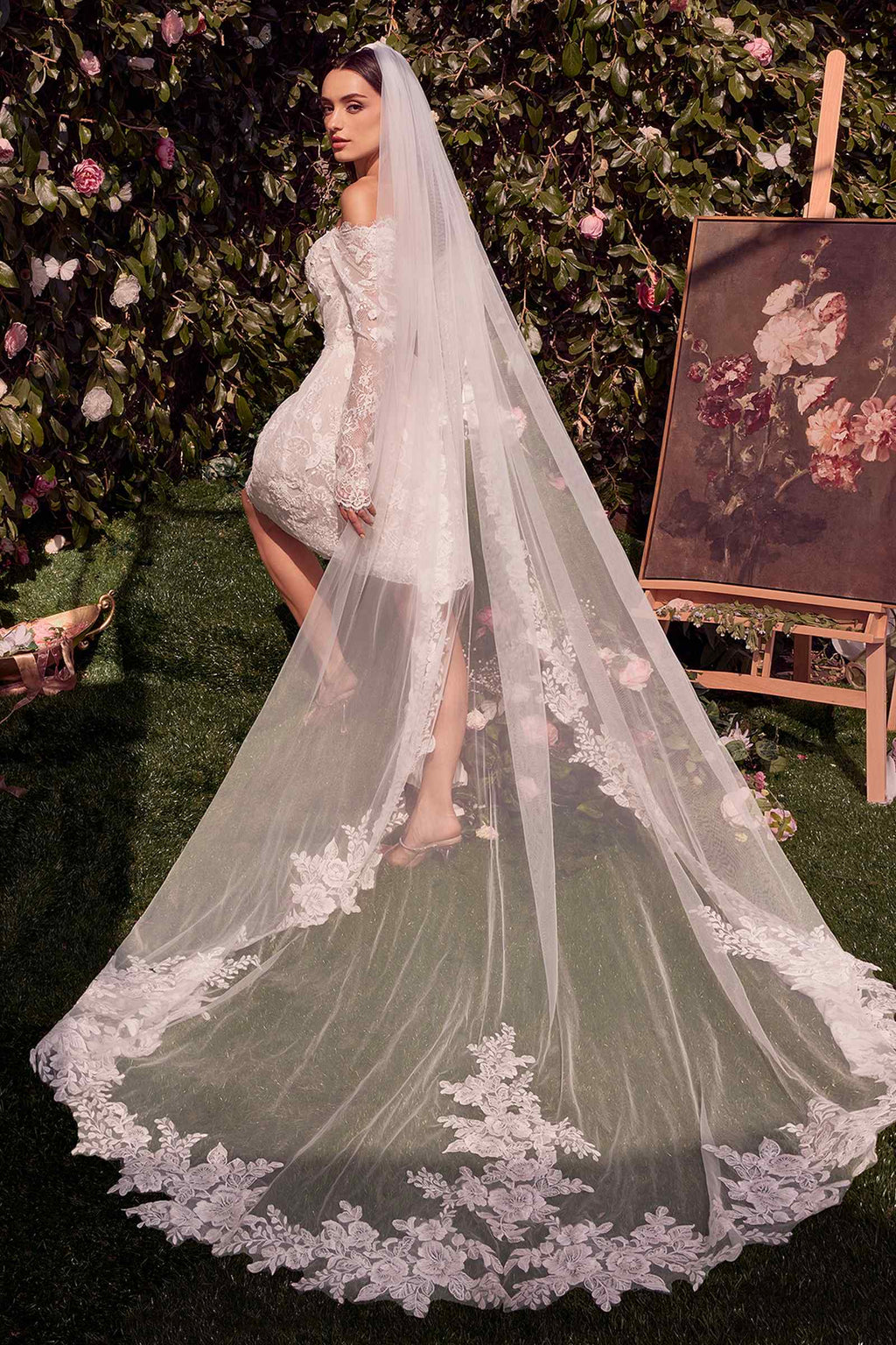 Off-shoulder off-white lace bridal dress with long sheer skirt overlay and train