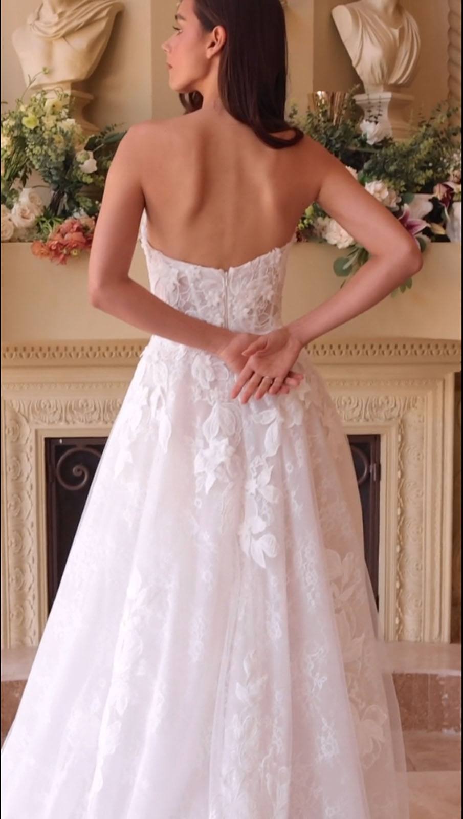 Off-white lace wedding dress with strapless bodice and lace-covered back