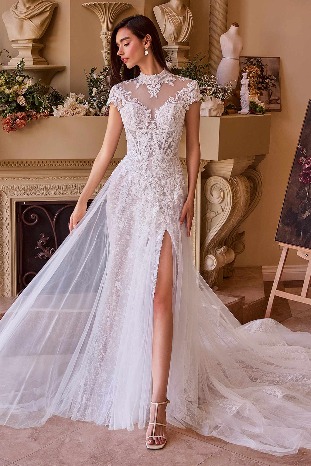 Off-white lace and tulle wedding dress with short sleeves, embroidered bodice, and front slit