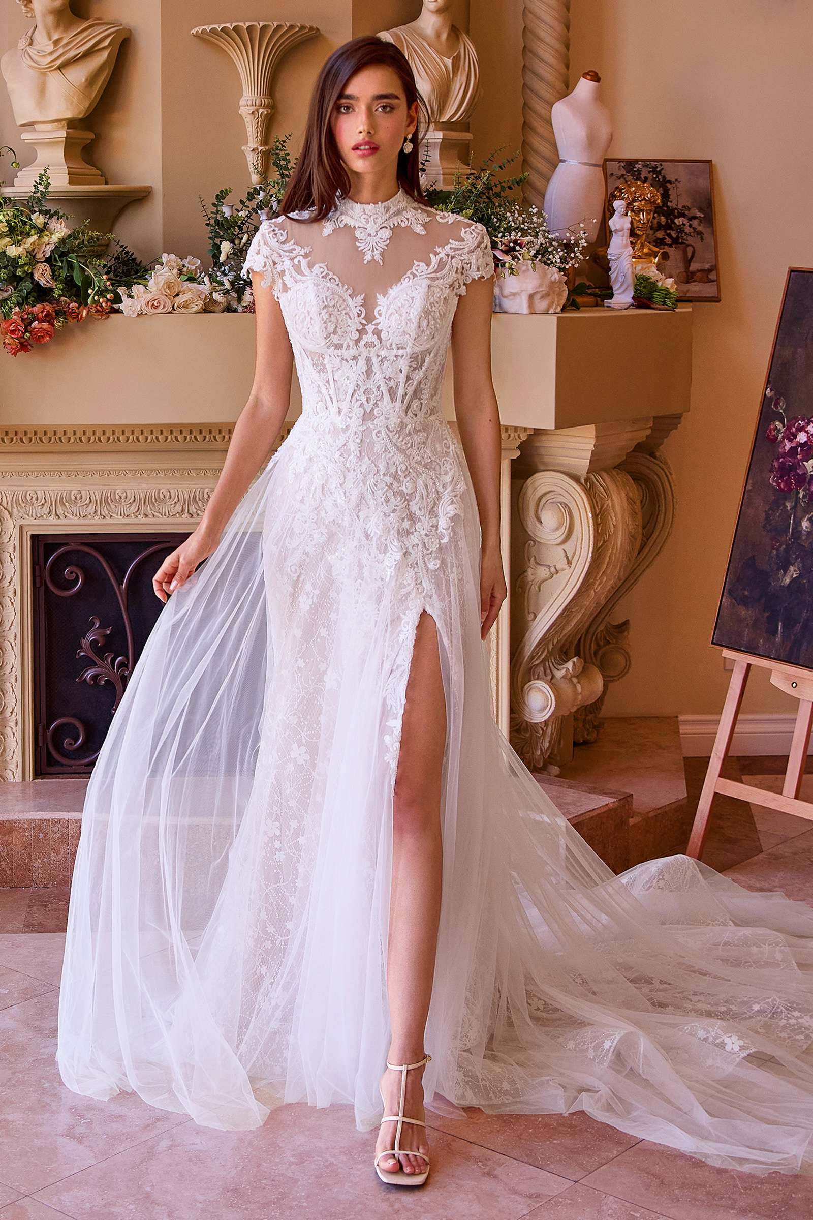 Off-white lace and tulle wedding dress with short sleeves, high neckline, and front slit