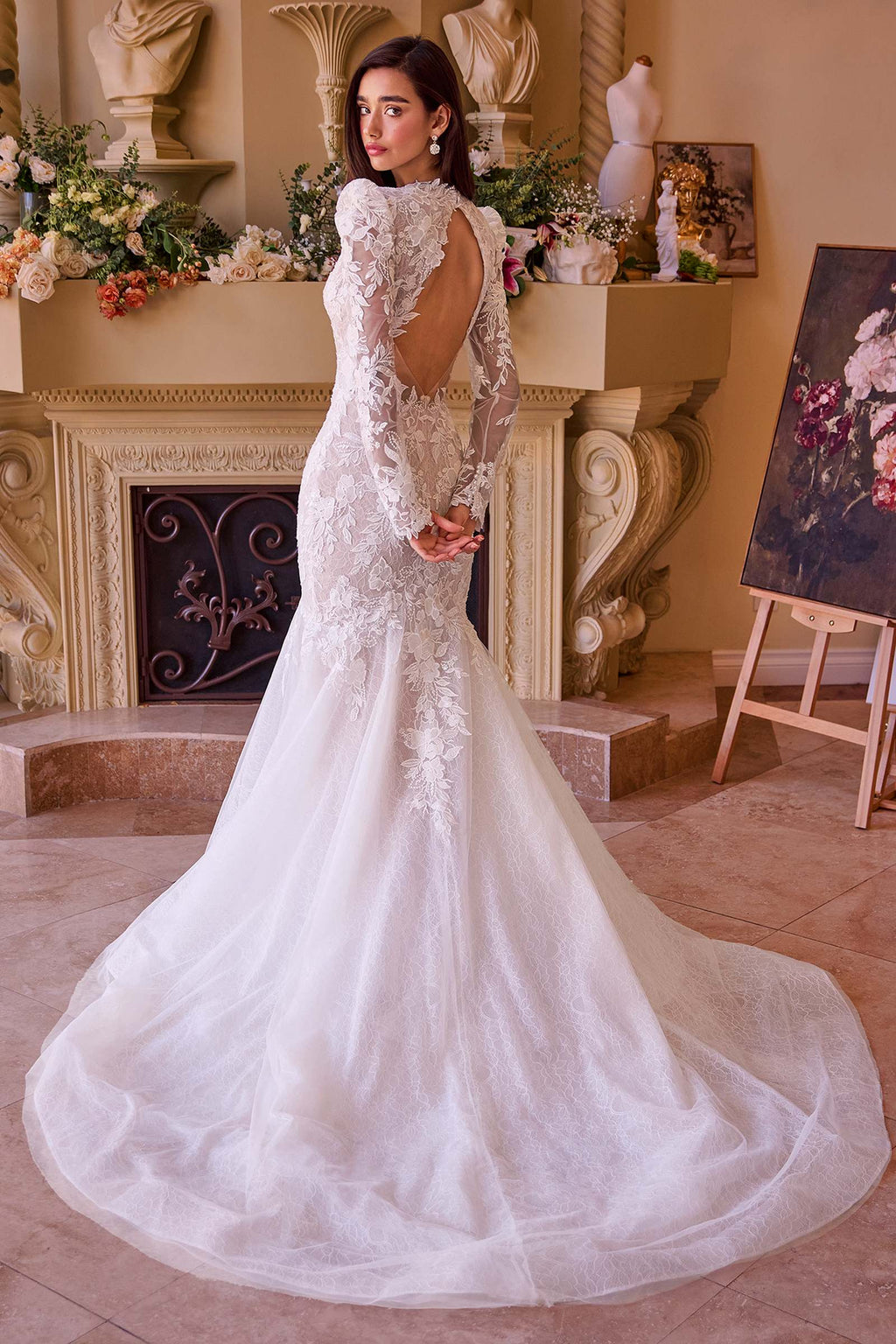 Off-white lace mermaid bridal gown with open back and flowing tulle skirt