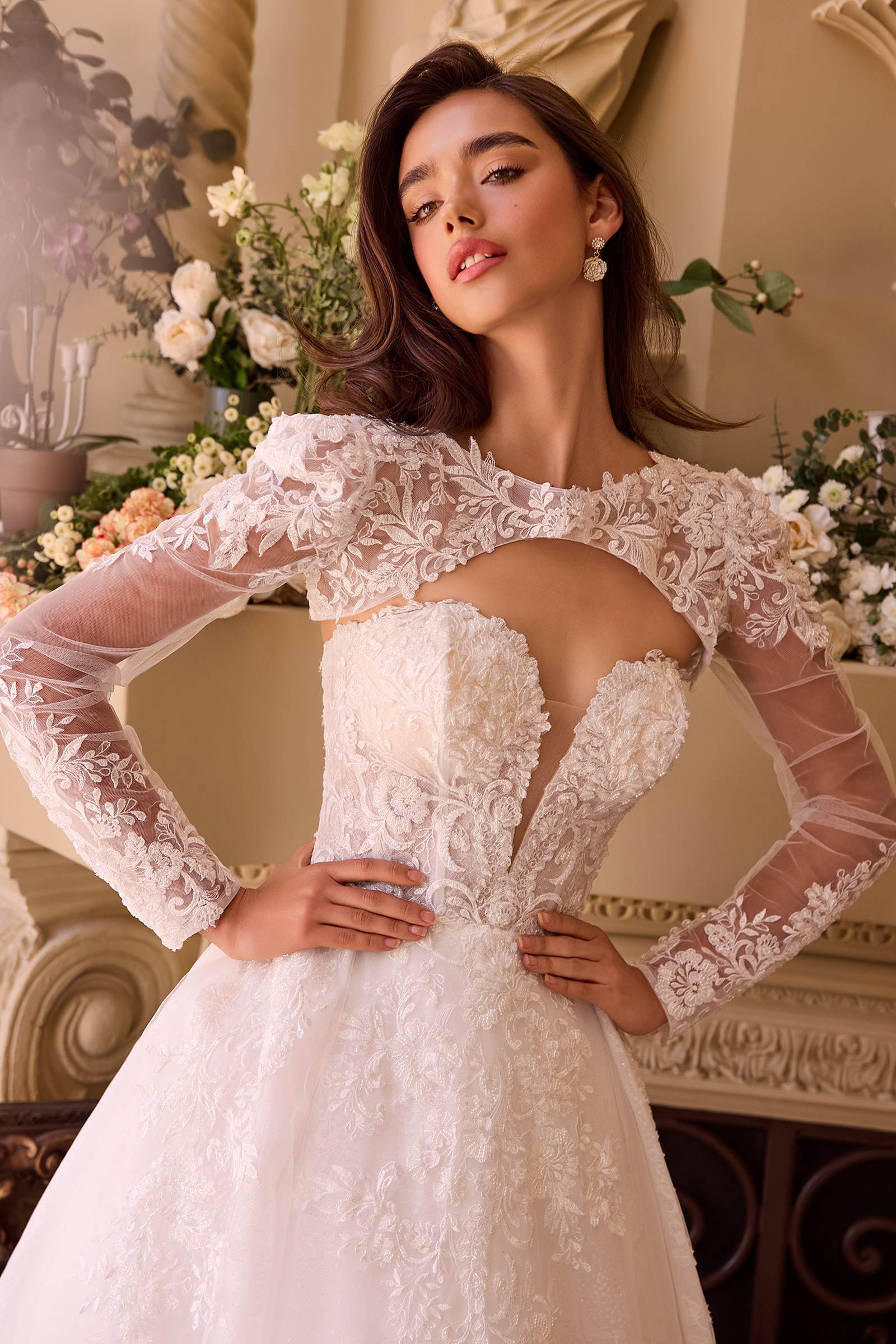 Off-white lace wedding ball gown with long sheer lace sleeves and fitted bodice