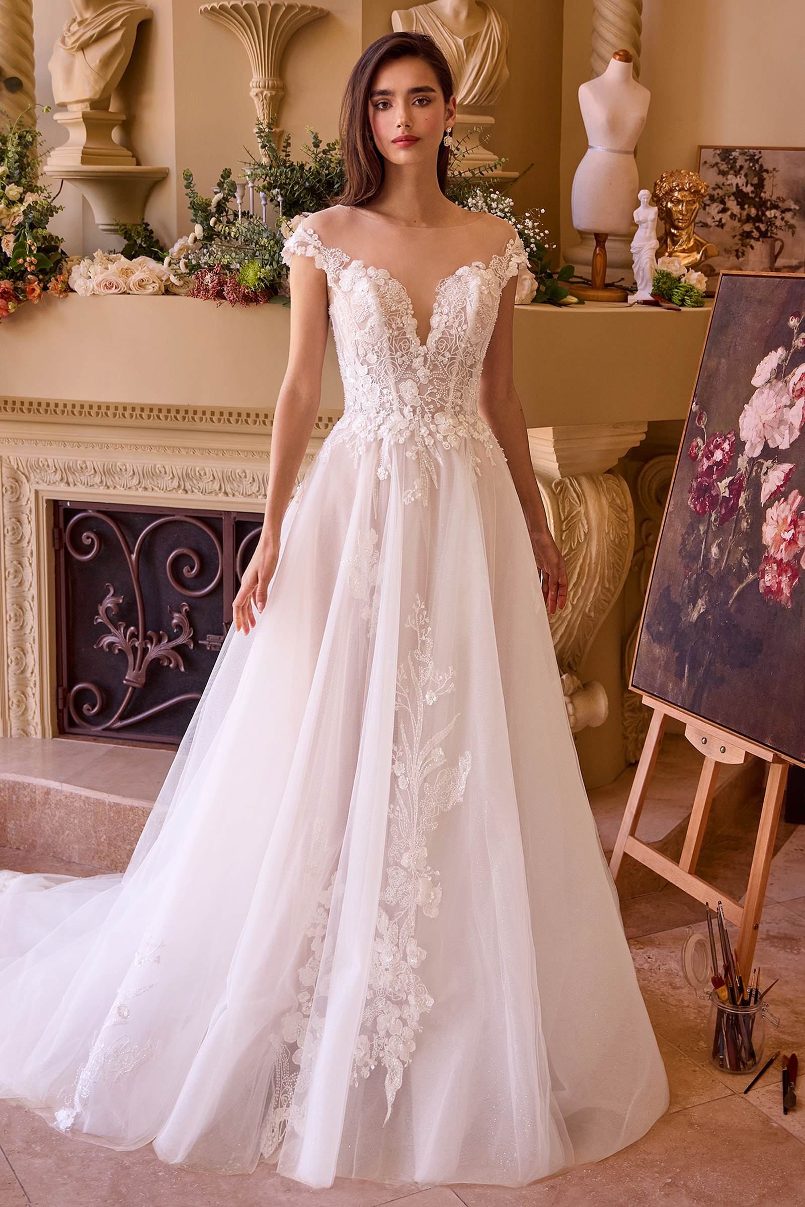 Off-white long bridal gown with lace cap sleeves, V-neck bodice, full tulle skirt
