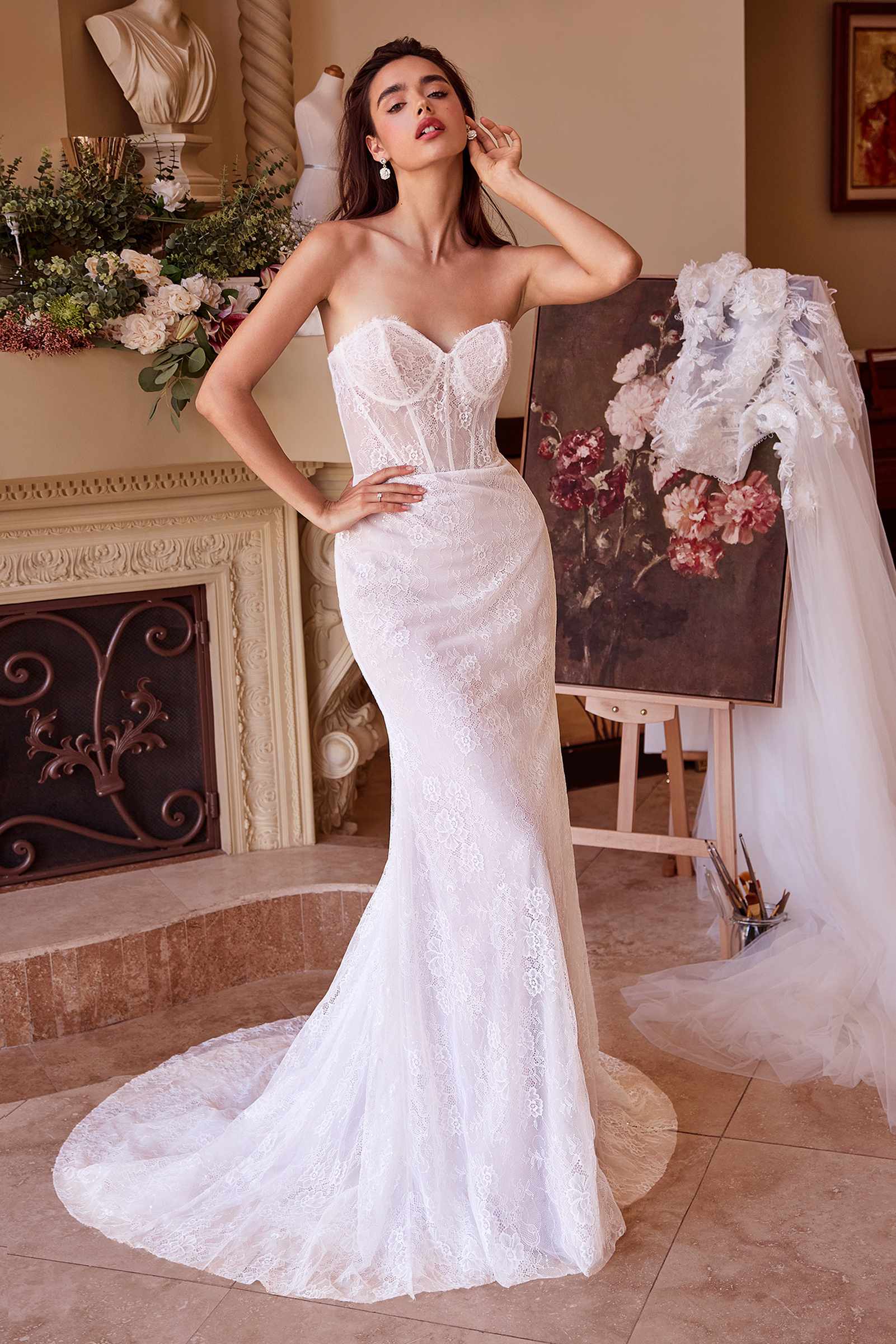 Off-white lace fitted wedding dress with strapless corset bodice and mermaid skirt