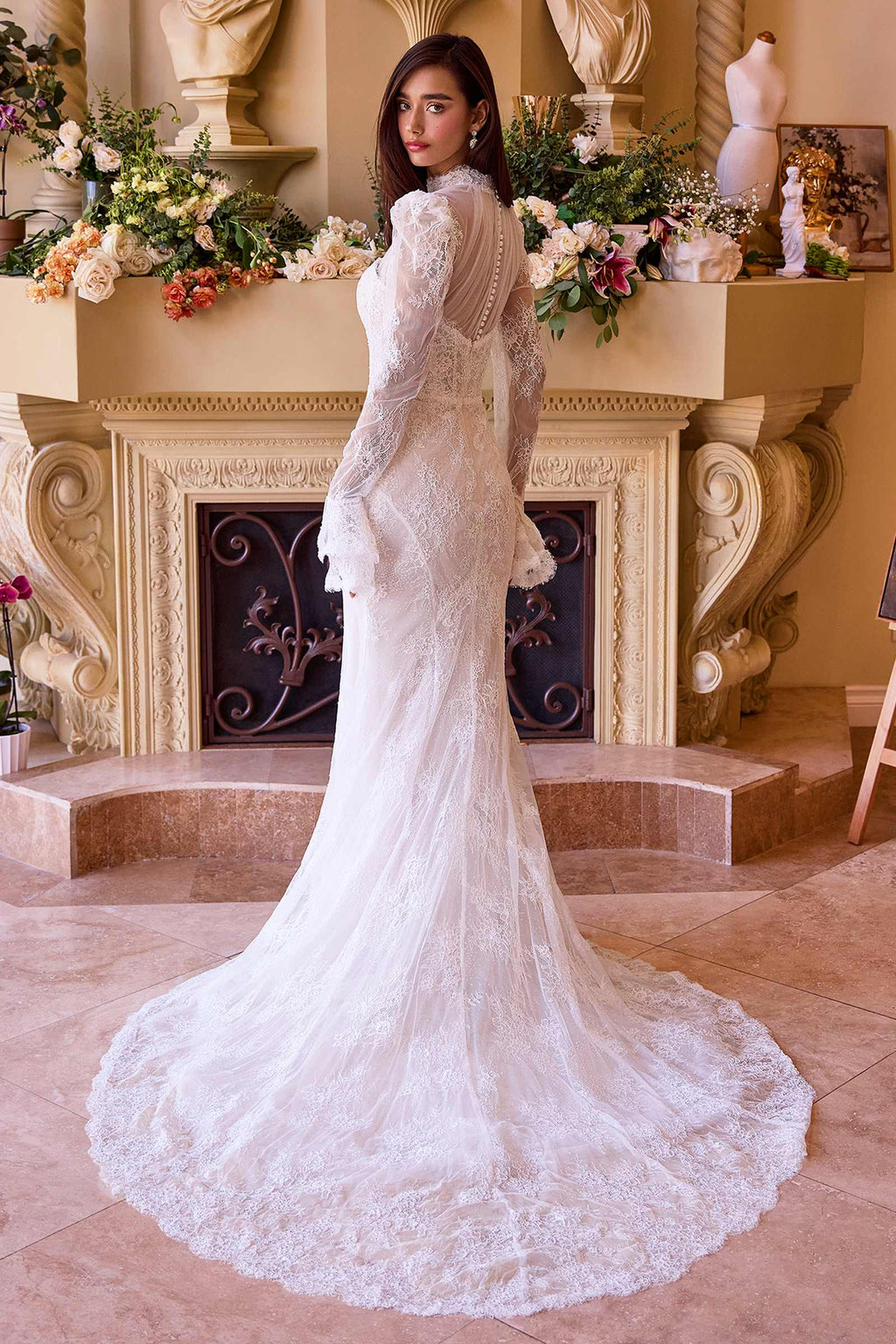 Off-white lace bridal gown with long sleeves and sheer overlay, mermaid-style hem