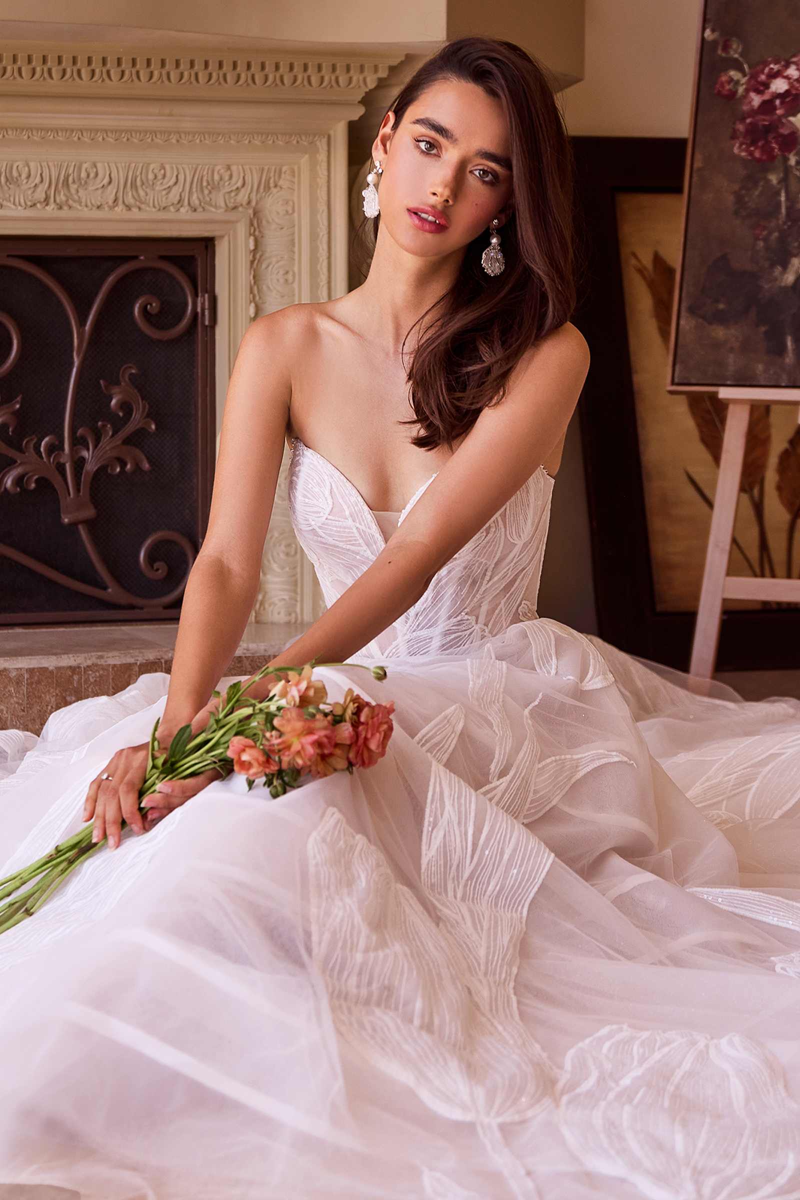 Off-white tulle ball gown dress with sweetheart neckline, corset bodice, and sequined embroidery