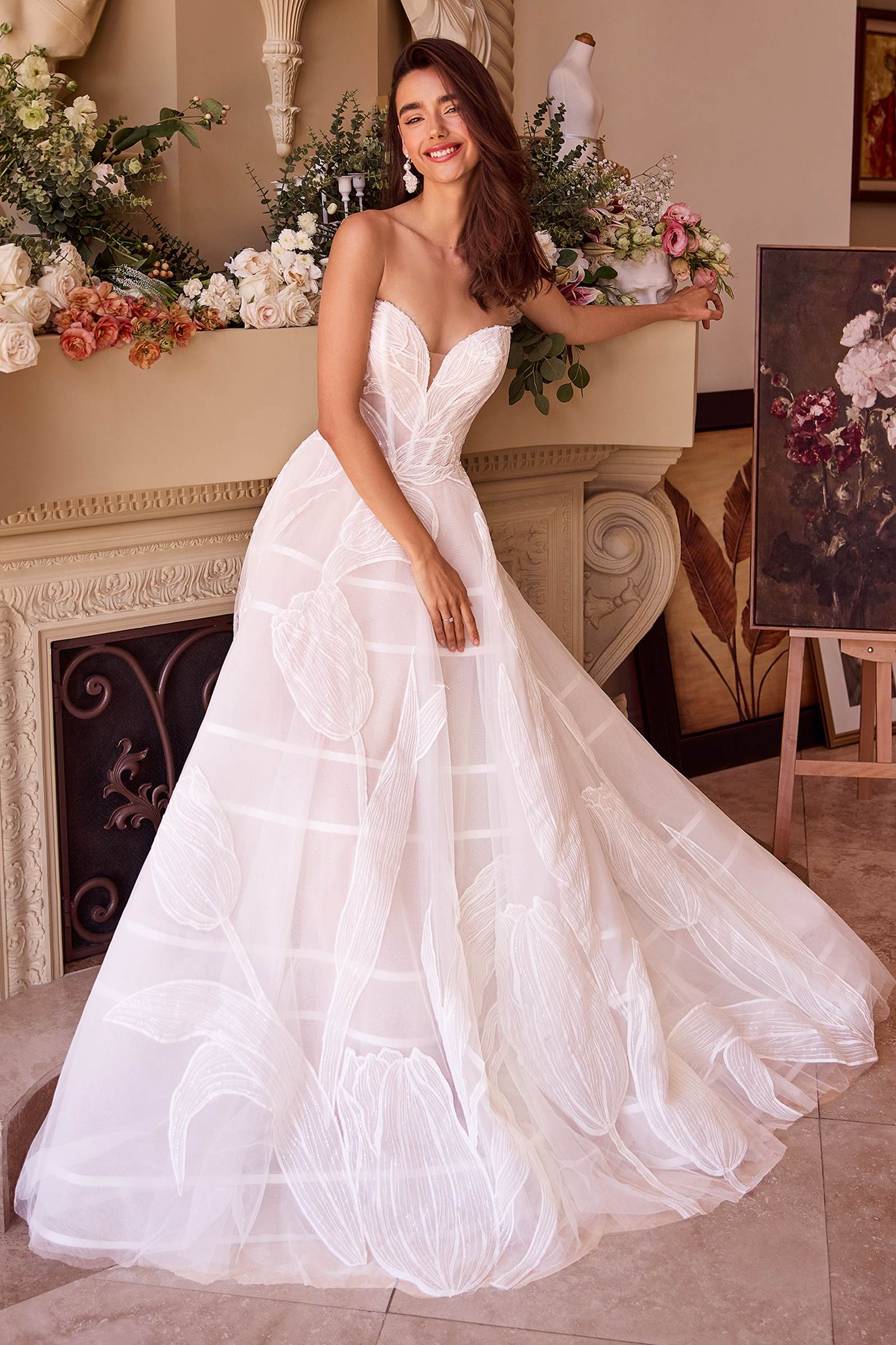 Off-white tulle wedding ball gown with sweetheart bodice and layered embroidered skirt