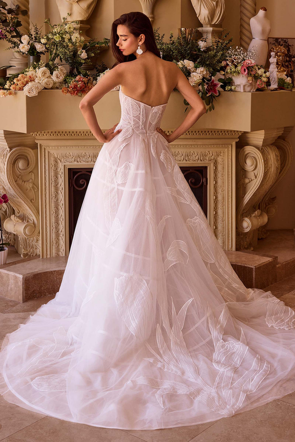 Off-white tulle ball gown with sweetheart corset top and full layered skirt with embroidery