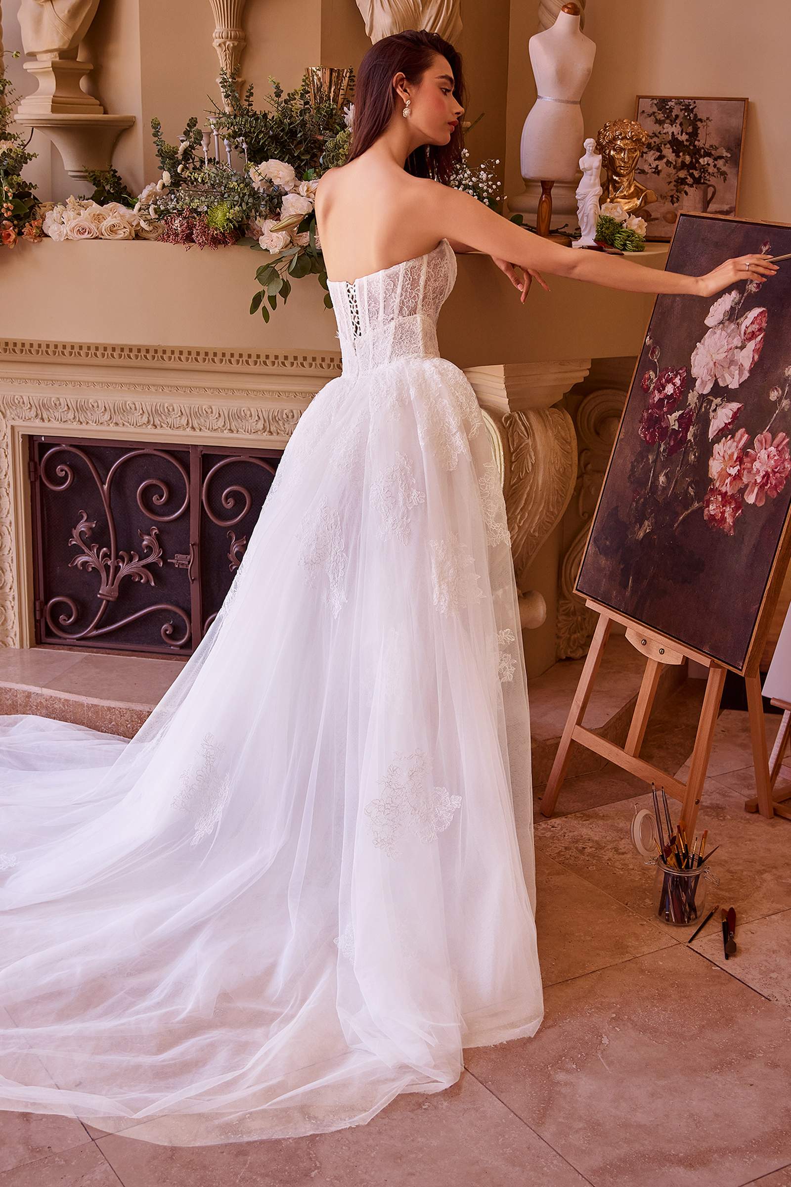 Off-white strapless lace wedding dress with sheer tulle overskirt, back view