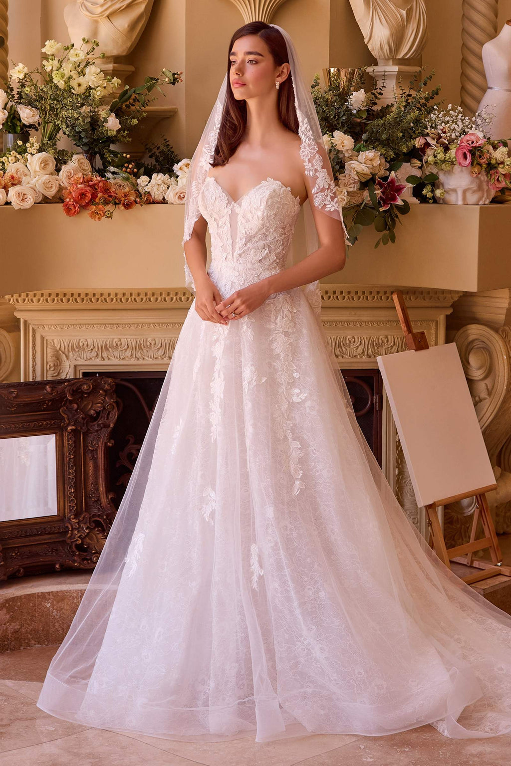 Off-white ball gown with lace bodice, illusion lace sleeves, and full tulle skirt