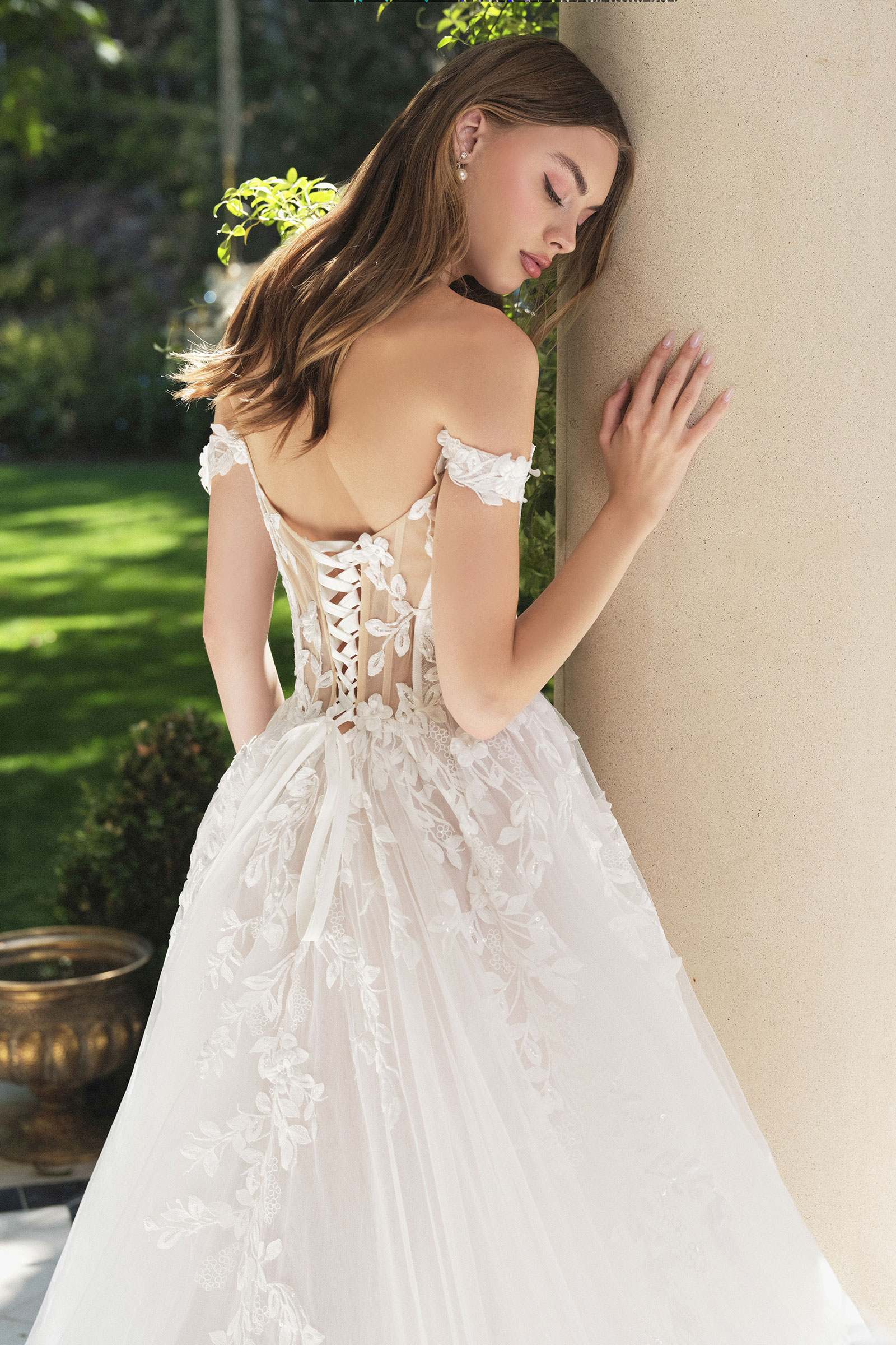 Off-white wedding A-line gown with off-shoulder lace bodice and embroidered tulle skirt