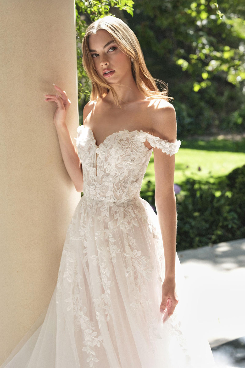 Off-white wedding A-line gown with off-shoulder lace bodice, fitted waist, and flared skirt