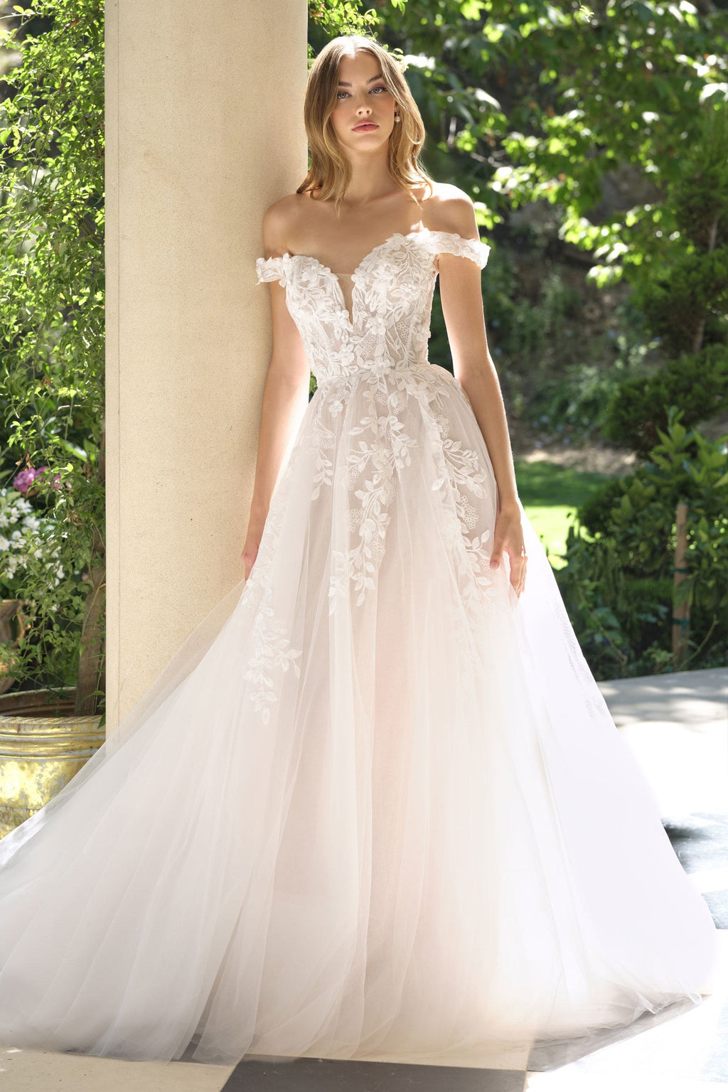 Off-white wedding A-line gown with off-shoulder lace bodice and full tulle skirt