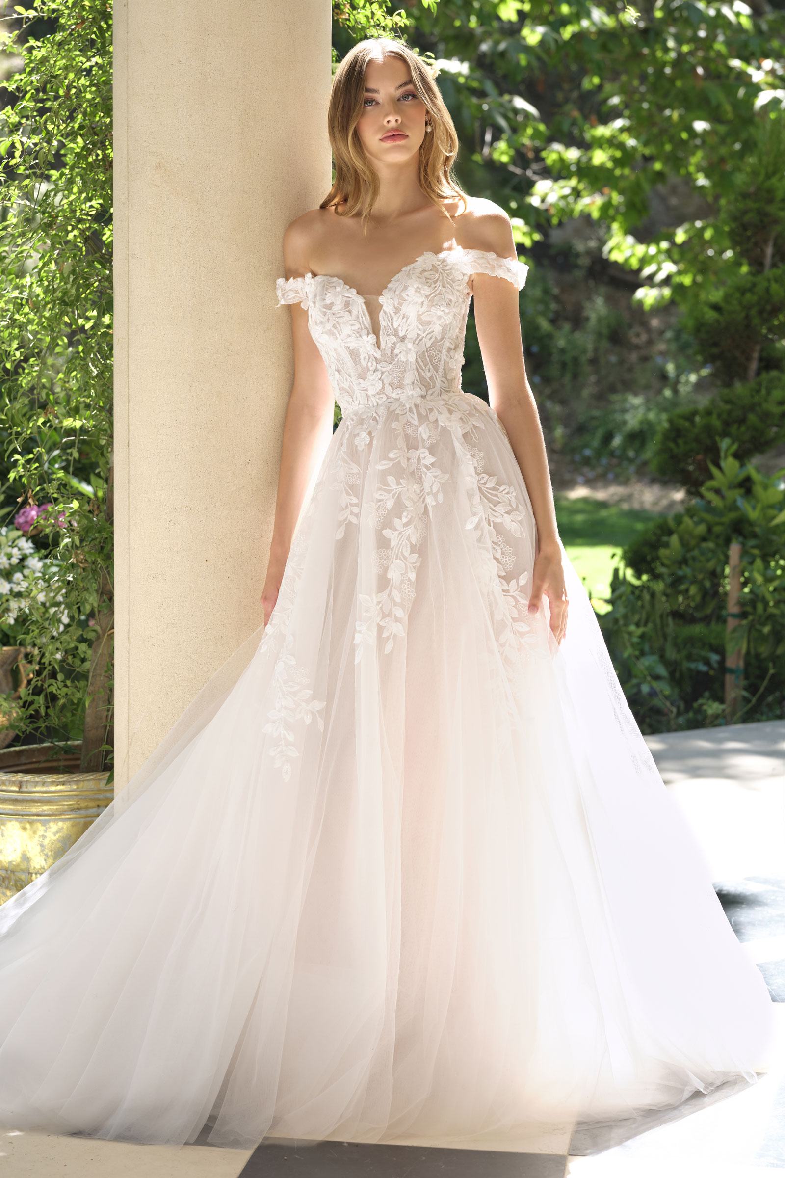 Off-white wedding A-line gown with off-shoulder lace bodice and full tulle skirt