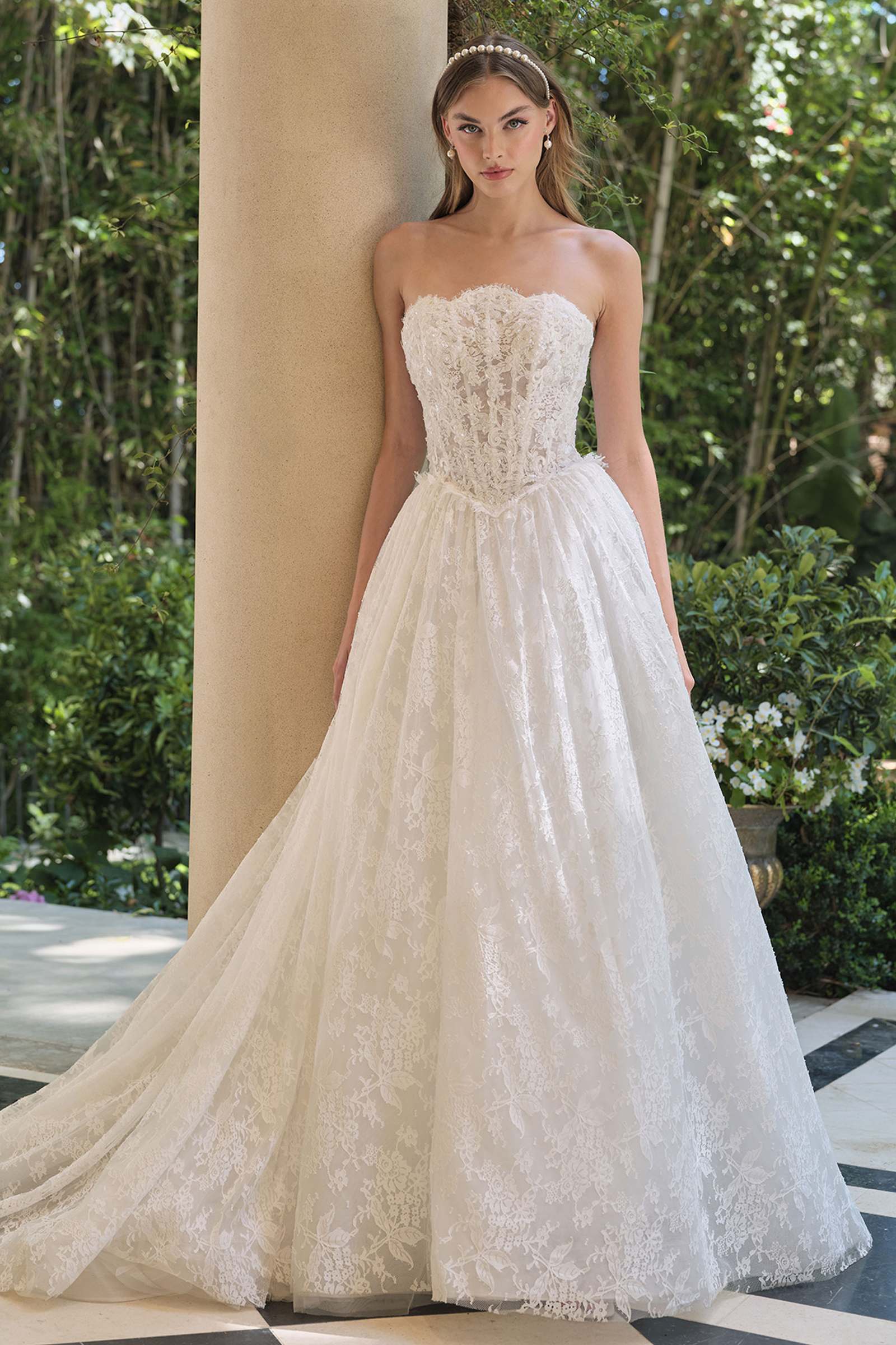 Off-white strapless lace A-line wedding gown with sweetheart bodice and textured skirt