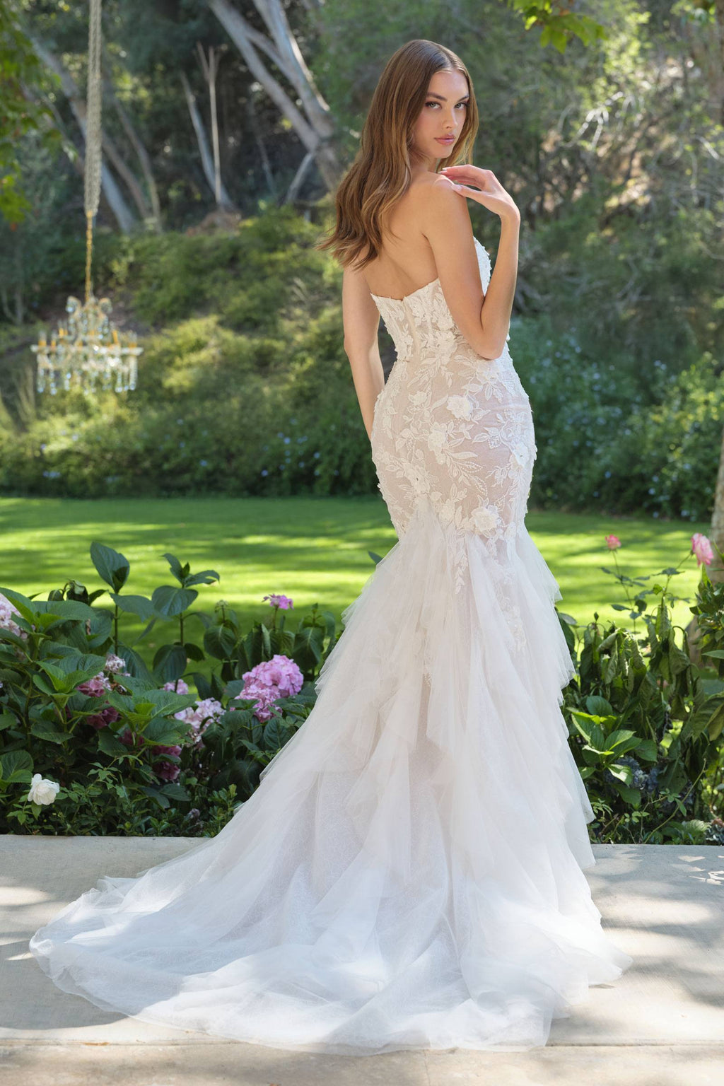 Open-back lace wedding gown with trumpet skirt and sweetheart neckline