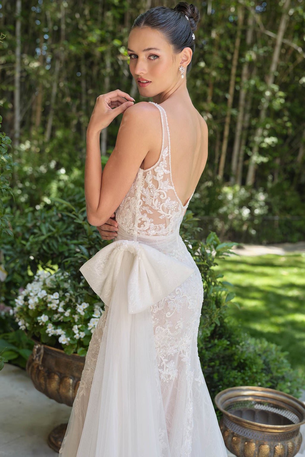 Off-white lace mermaid dress with V-back, fitted bodice, embroidered skirt overlay