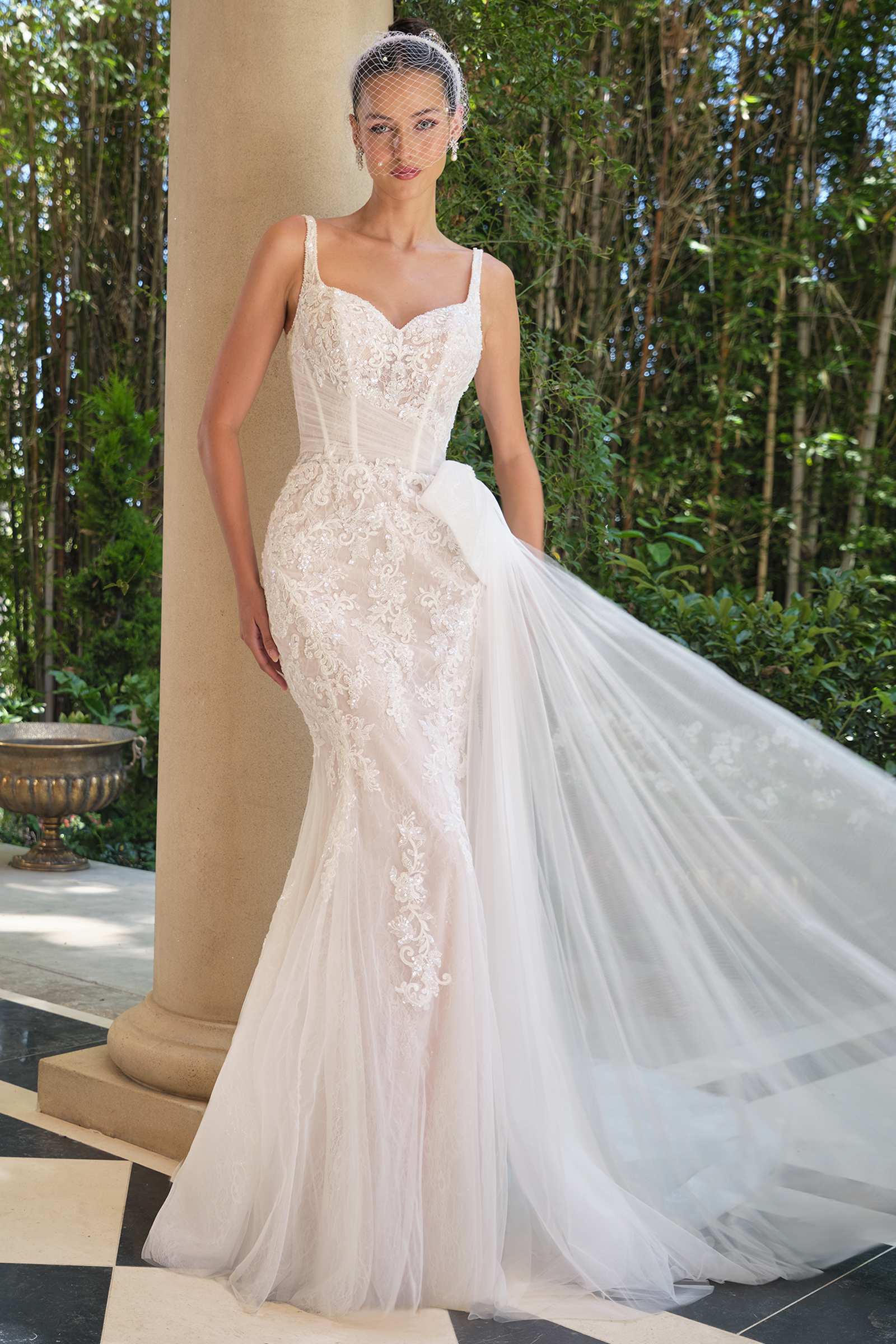 Off-white embroidered lace mermaid dress with sweetheart neckline and flowing tulle skirt