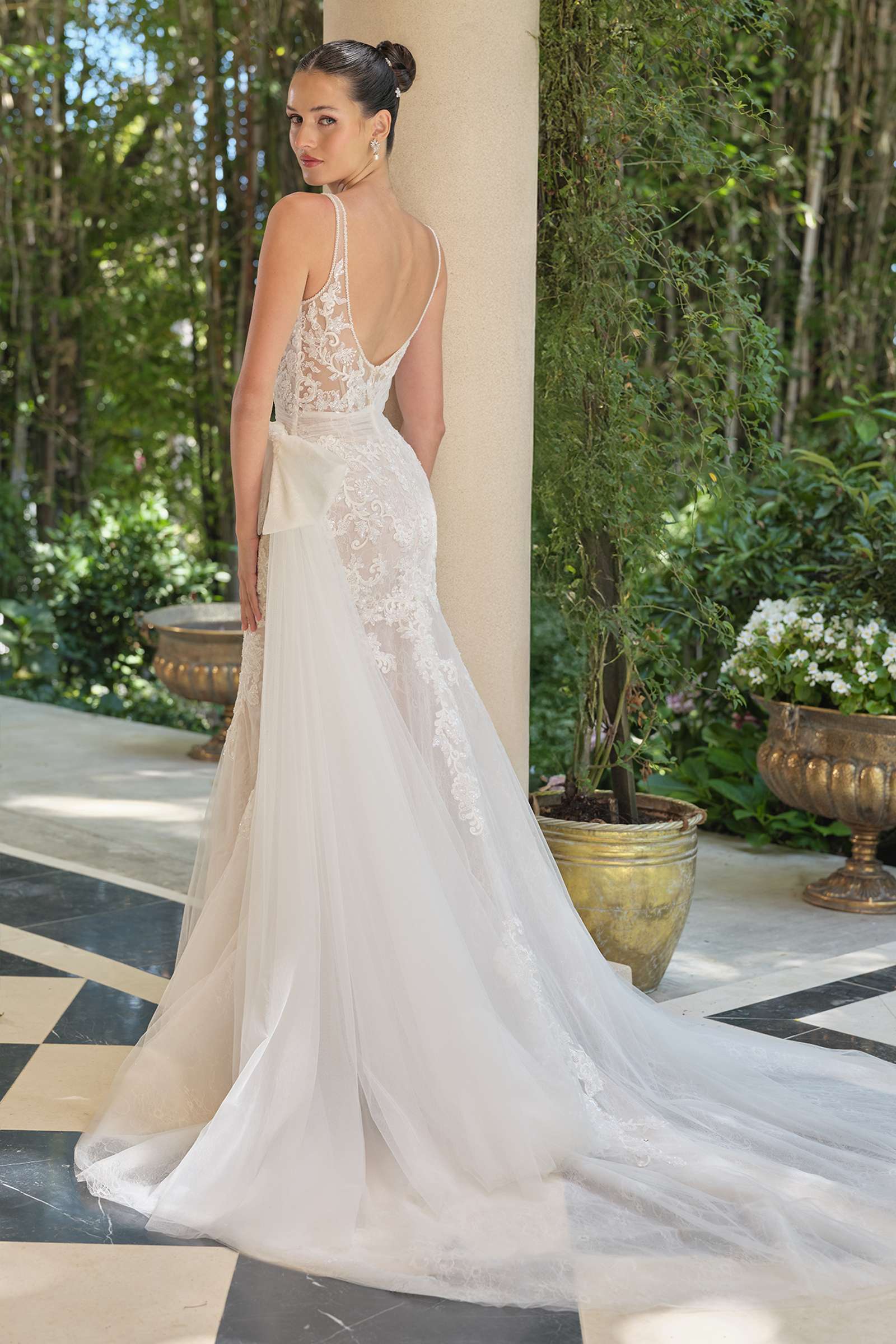 Off-white lace mermaid dress with open back, thin straps, fitted waist, flared hem