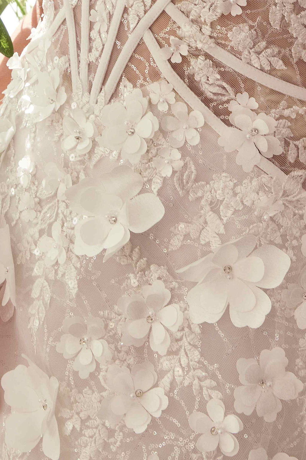 Off-white lace fabric with layered floral appliqué and embroidered bodice pattern