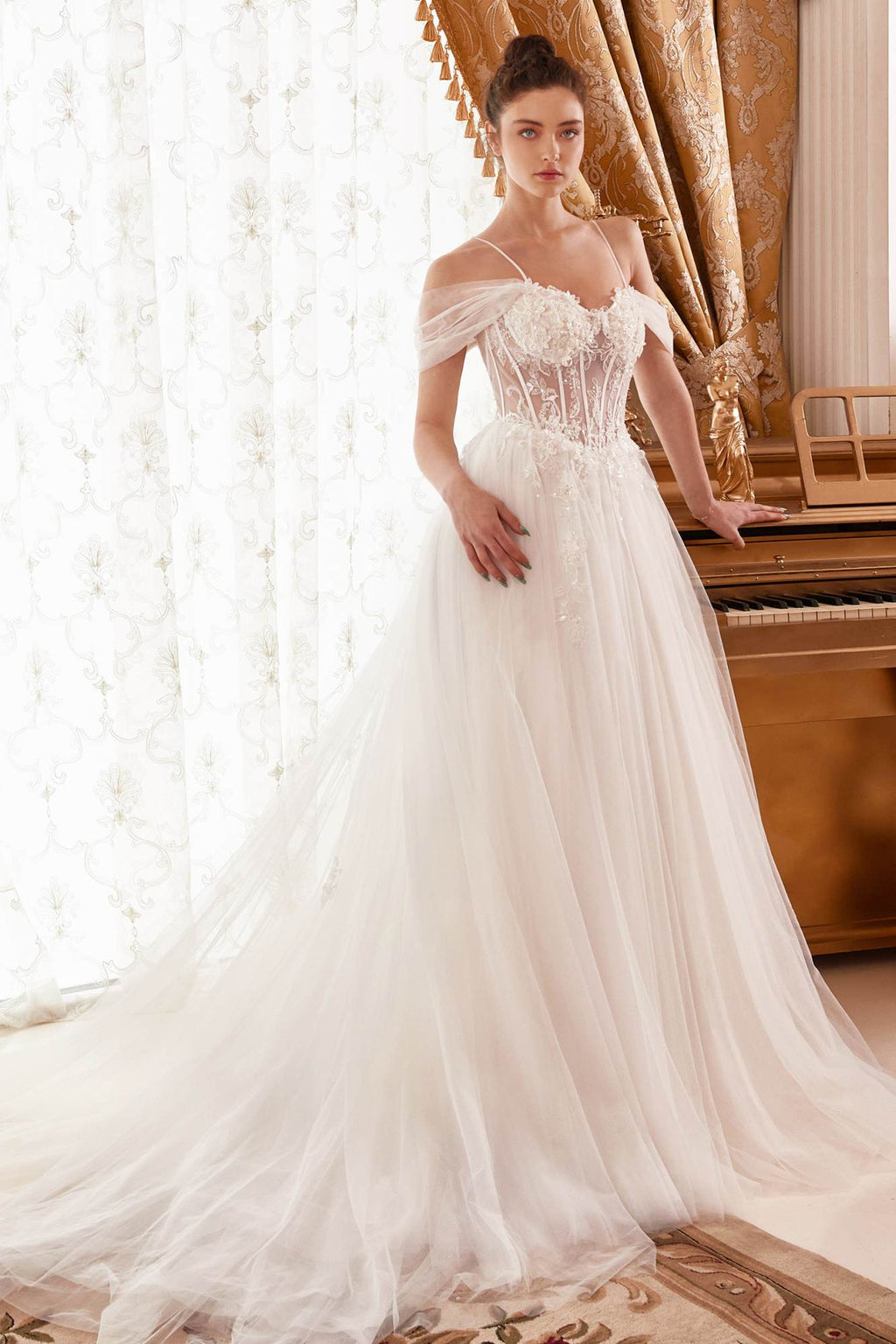Off-white corset bodice A-line bridal gown with lace bodice and flowing tulle skirt