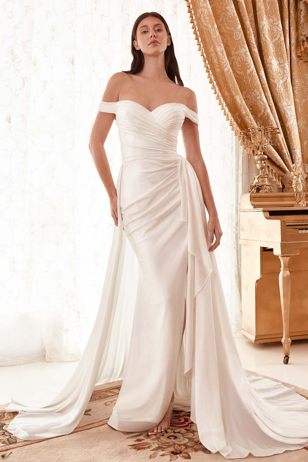 Off-white long off-shoulder bridal gown with draped bodice, fitted skirt, and trailing train