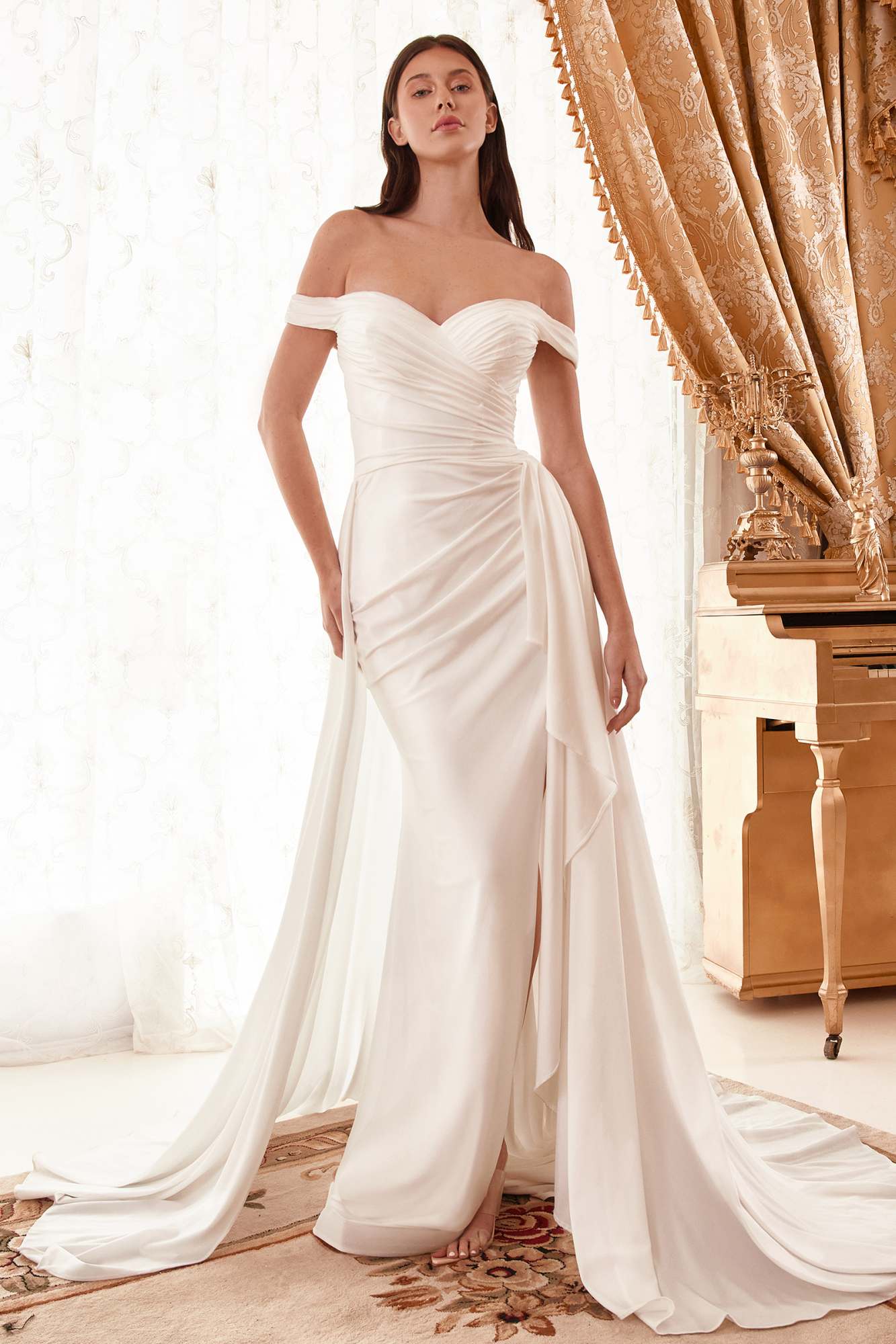 Off-the-shoulder draped bridal gown with flowing long skirt, off-white