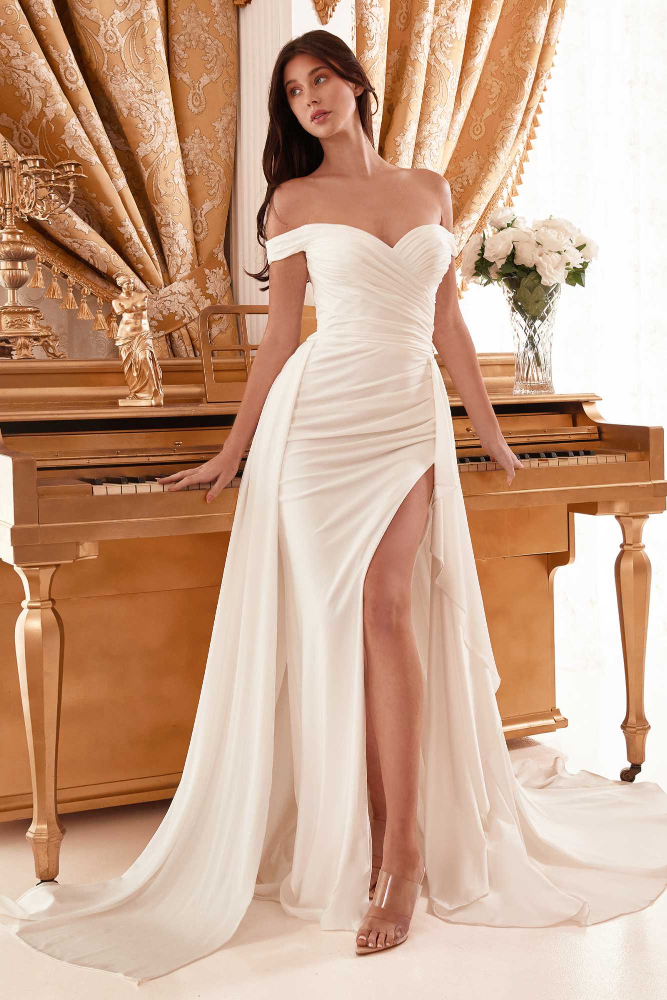Off-white off-shoulder bridal gown with draped bodice, thigh slit detail, and long train