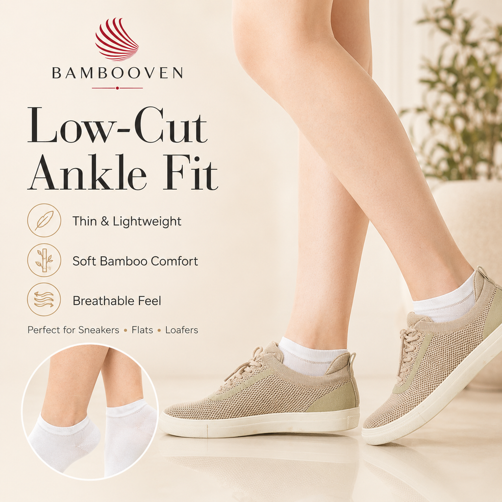 Women’s low-cut bamboo ankle socks on feet with sneakers, white