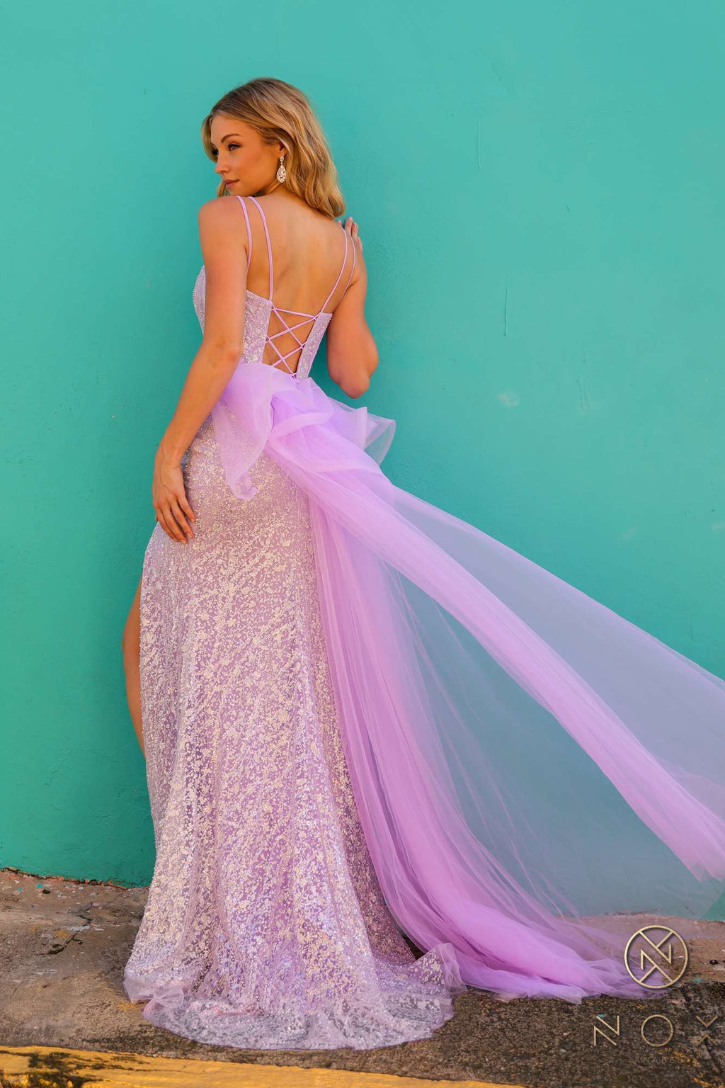 Lilac fitted evening gown with sweetheart neckline, ruffled overskirt and flowing train