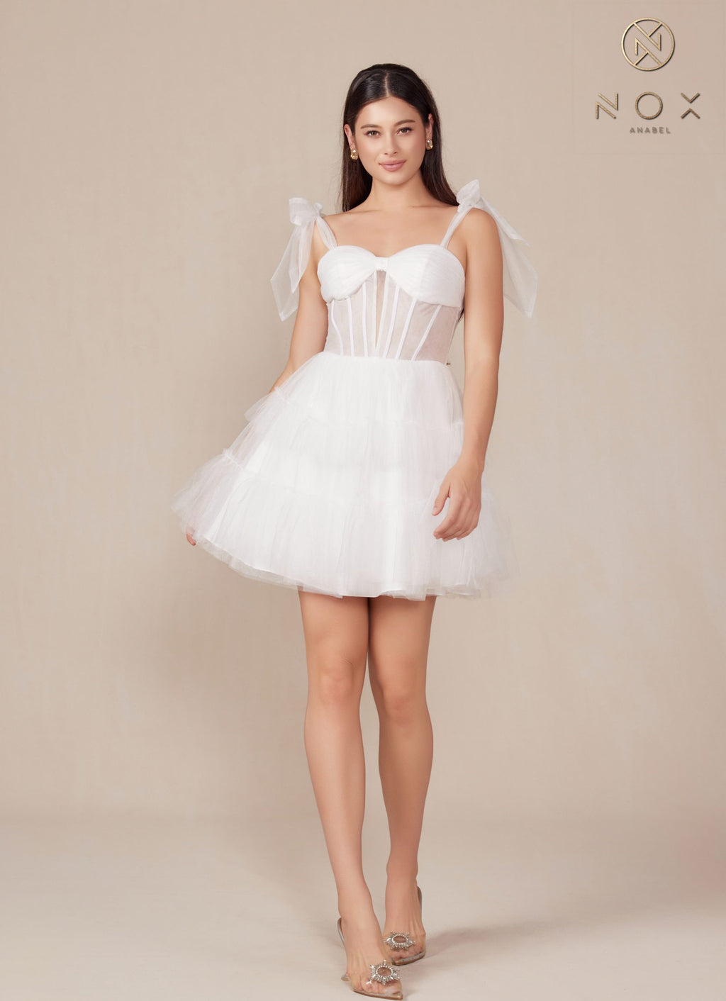 White A-line tulle dress with sweetheart bodice, bow shoulder straps, tiered ruffle skirt