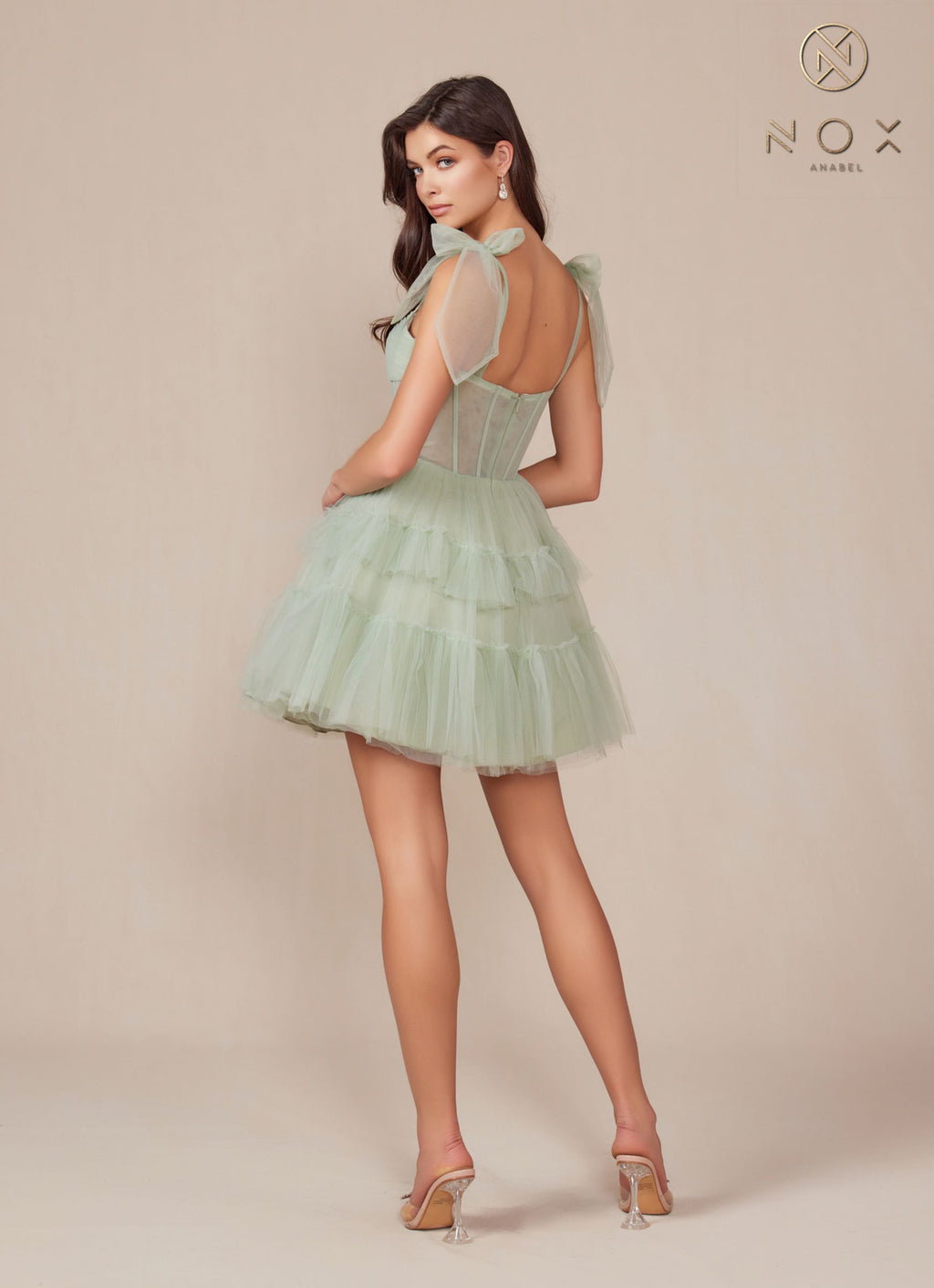 Sage green A-line tulle dress with tiered ruffle skirt, sleeveless design