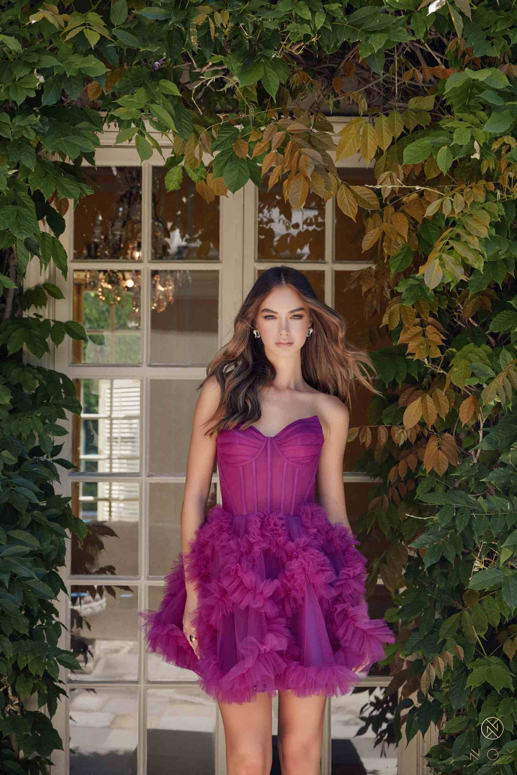 Strapless sweetheart A-line dress in dusty magenta with voluminous ruffled skirt