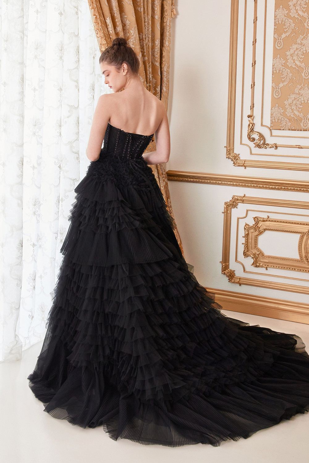 Black corset ball gown with sweetheart neckline and layered tulle ruffle skirt