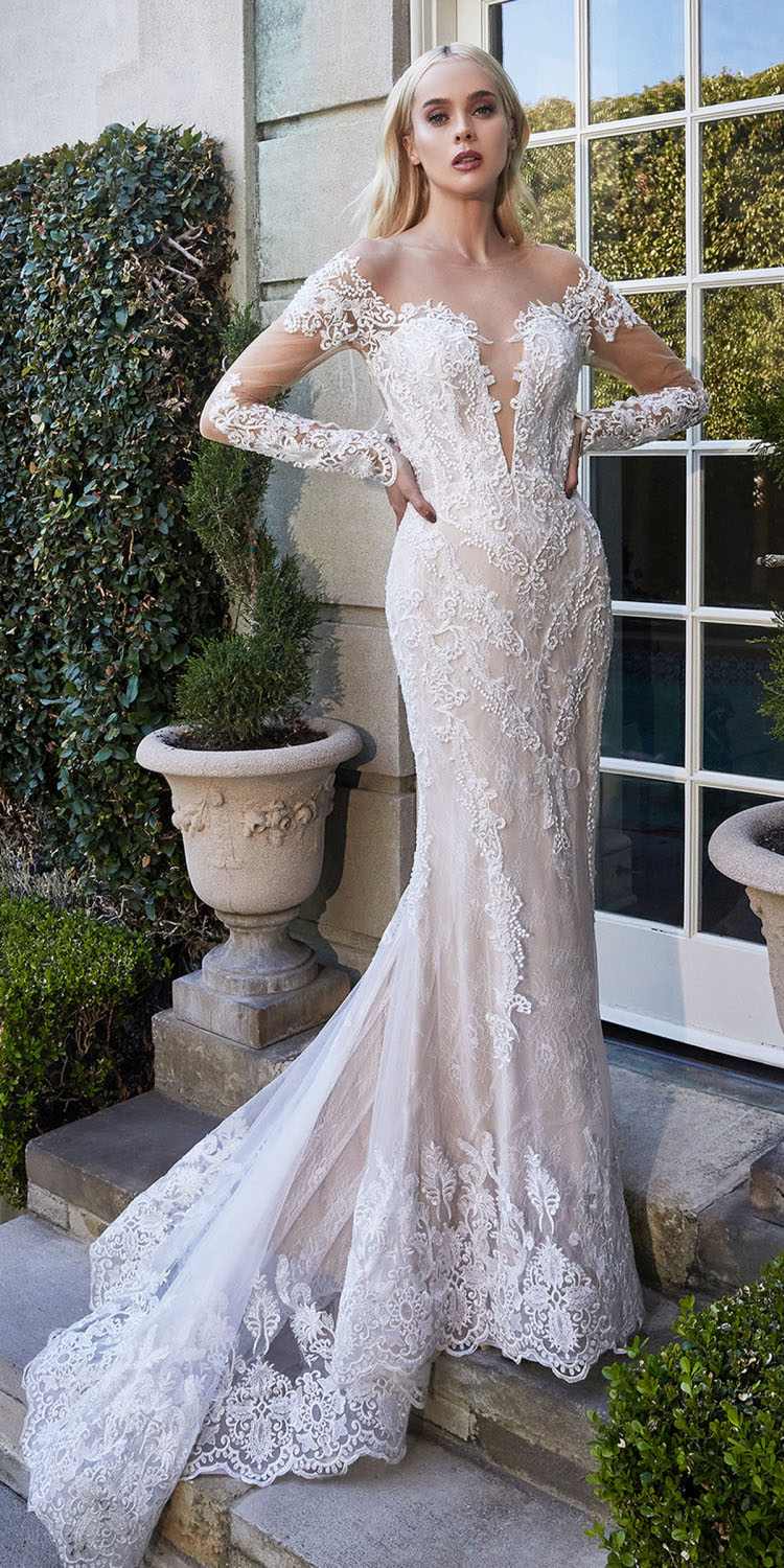 Off-white bohemian lace mermaid gown with illusion sleeves and lace corset-style fit