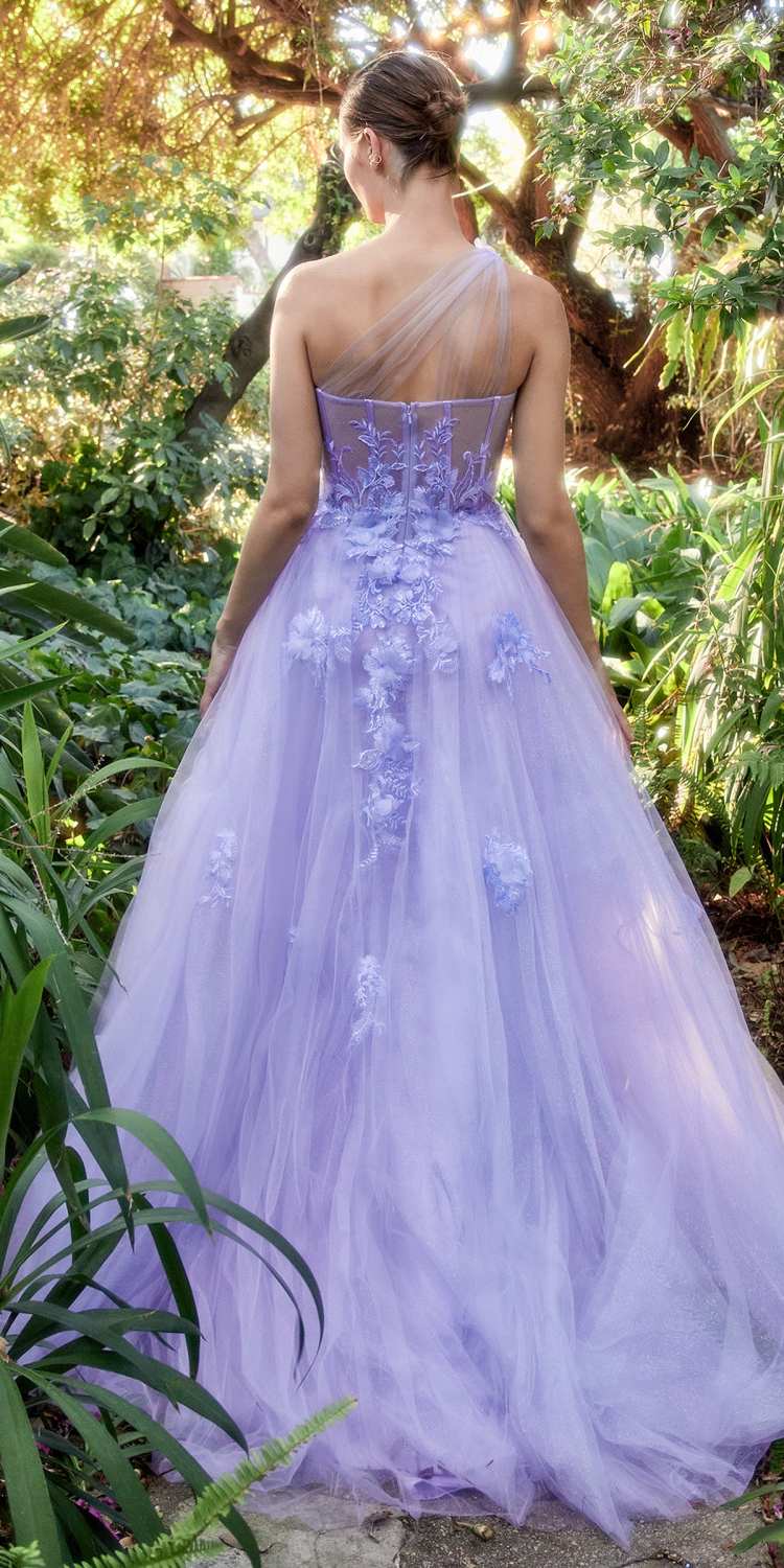 Back view of an A-line ball gown with lace appliques and flowing lilac tulle skirt