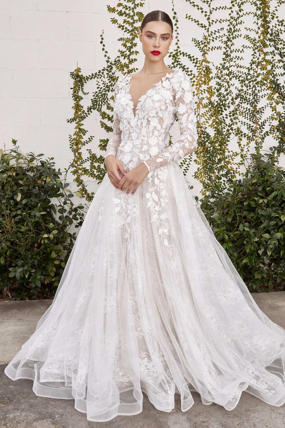 Off-white lace wedding gown with sweetheart neckline, fitted lace bodice, and full skirt
