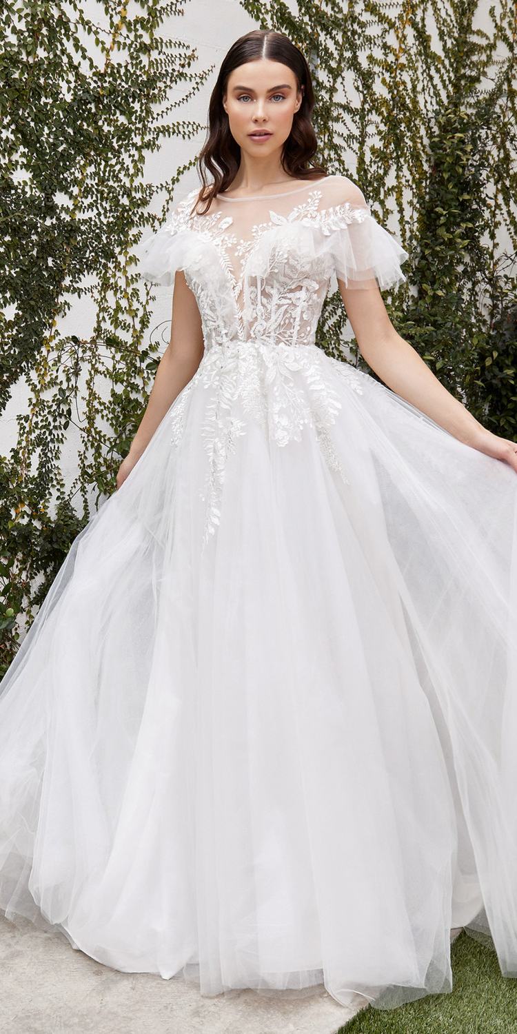 Off-white A-line wedding gown with lace bodice, sheer cap sleeves, and tulle skirt