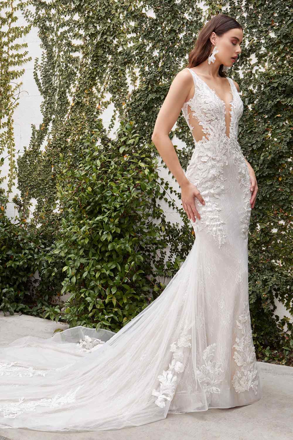 Off-white lace wedding gown with V-back appliques and flowing train