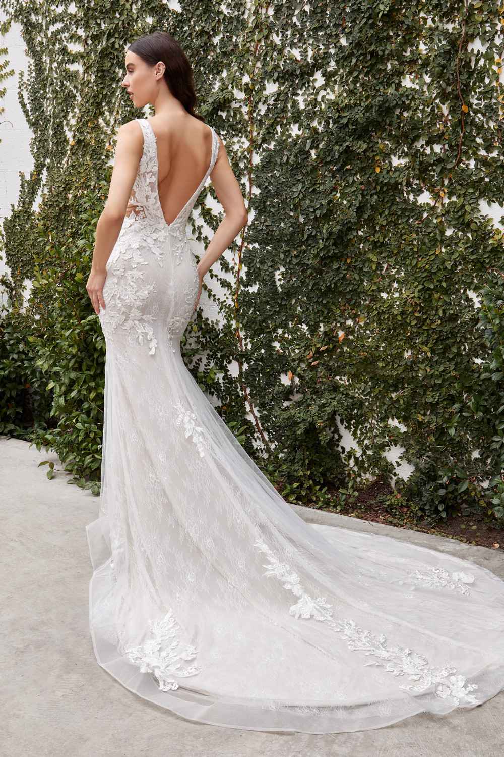 Off-white lace wedding gown with lace V-back and draped mermaid skirt