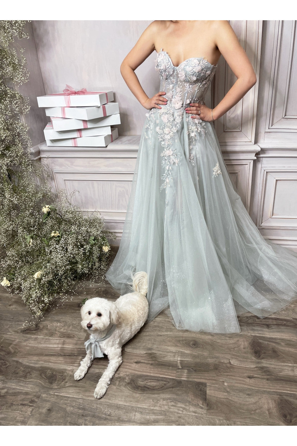 Sage green strapless gown with floral embroidery, sweetheart bodice, and full tulle skirt