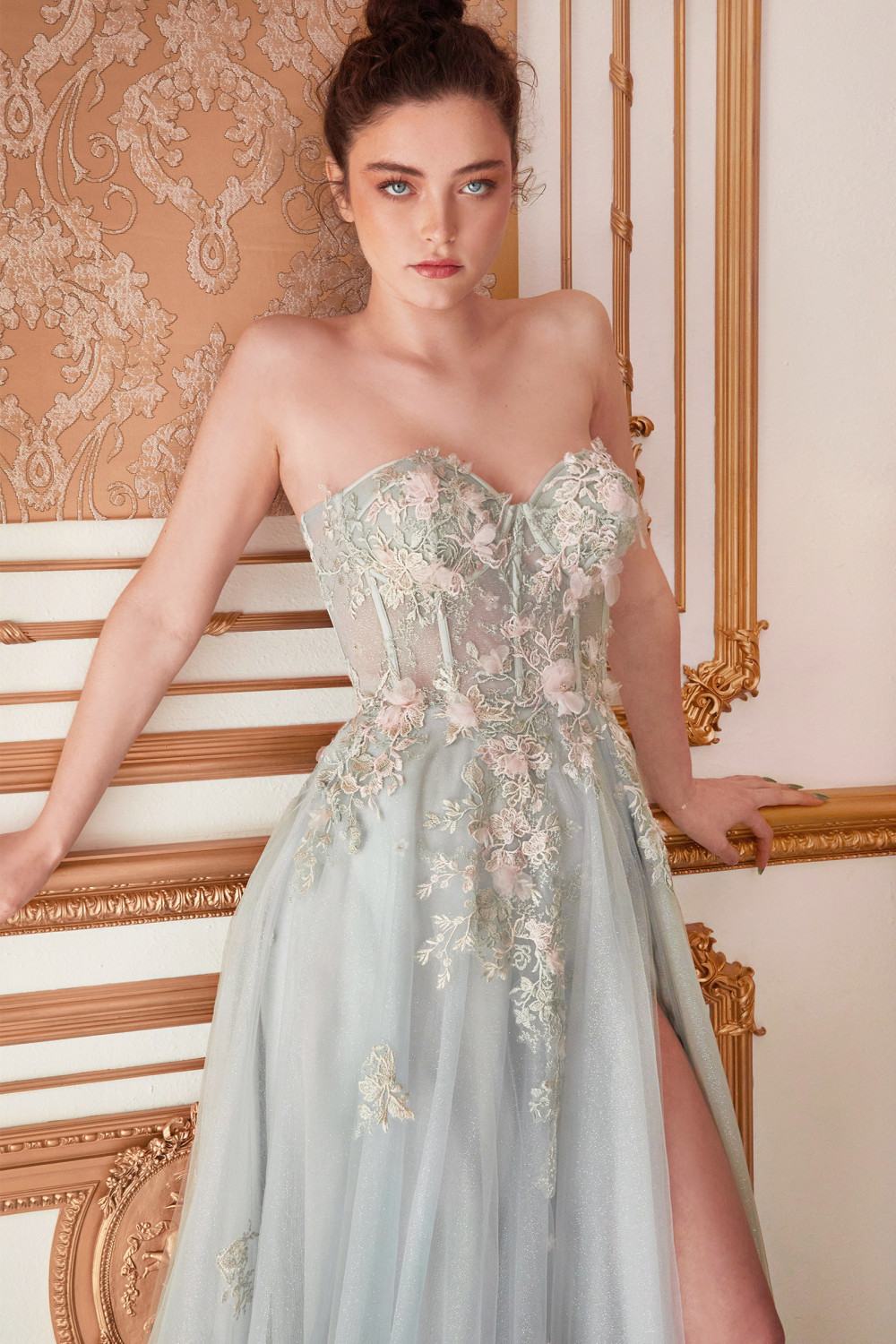 Pale green strapless embroidered gown with sheer overskirt and front slit