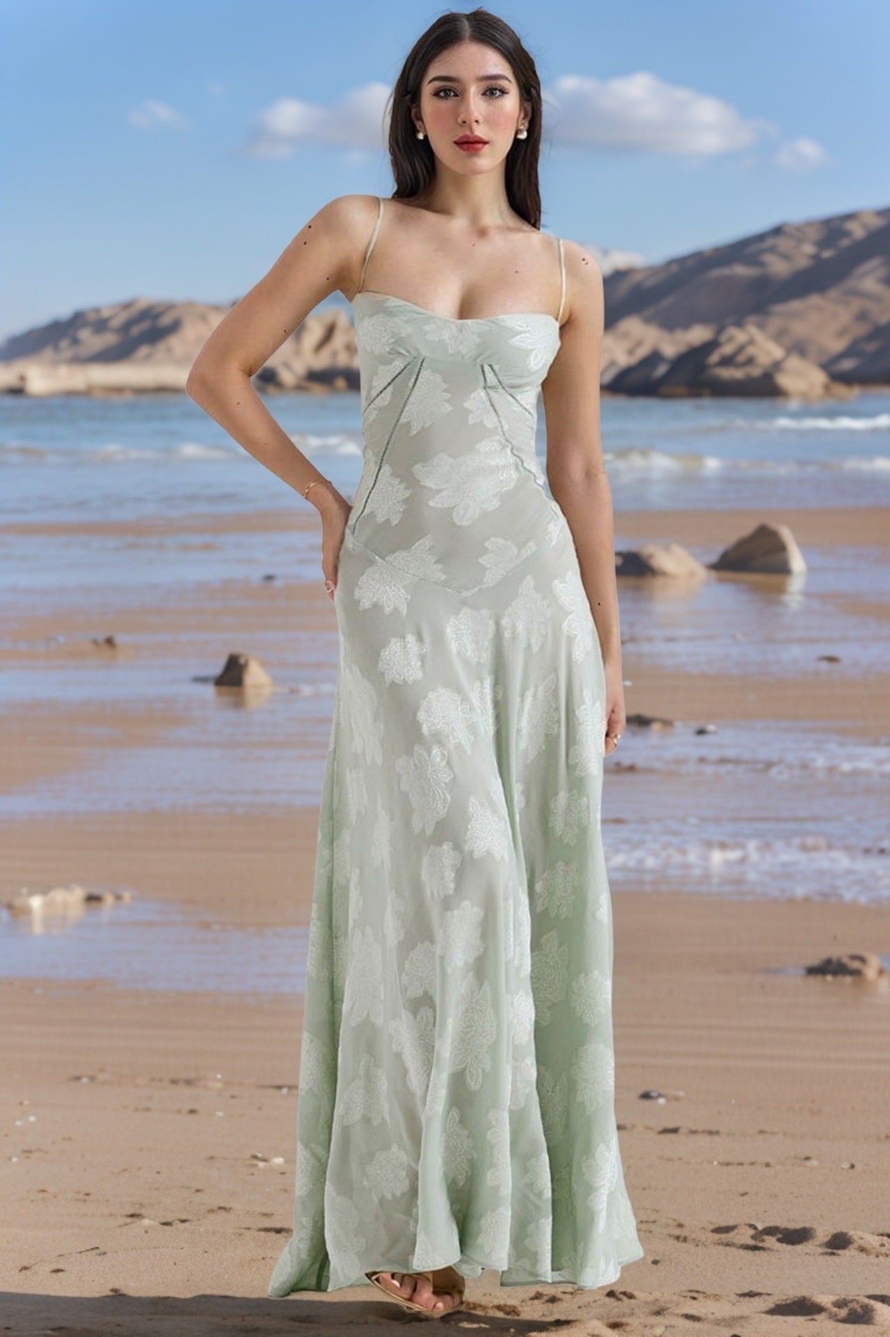 Mint green lace suspender dress with floral pattern, spaghetti straps, and long skirt