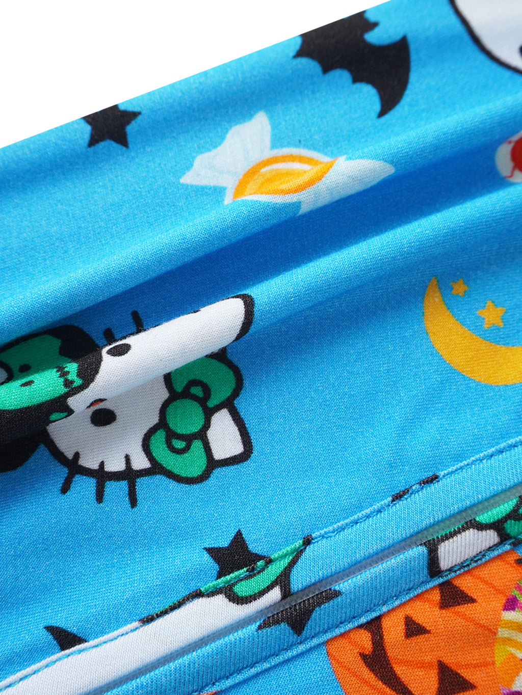 Blue bamboo romper close-up with zipper seam and Halloween print