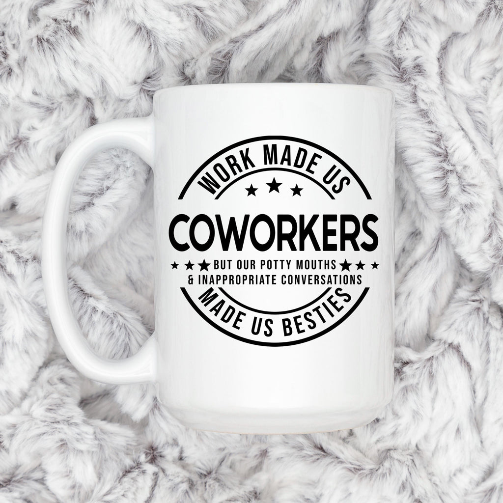 White ceramic mug with black coworker humor print and C-shaped side handle