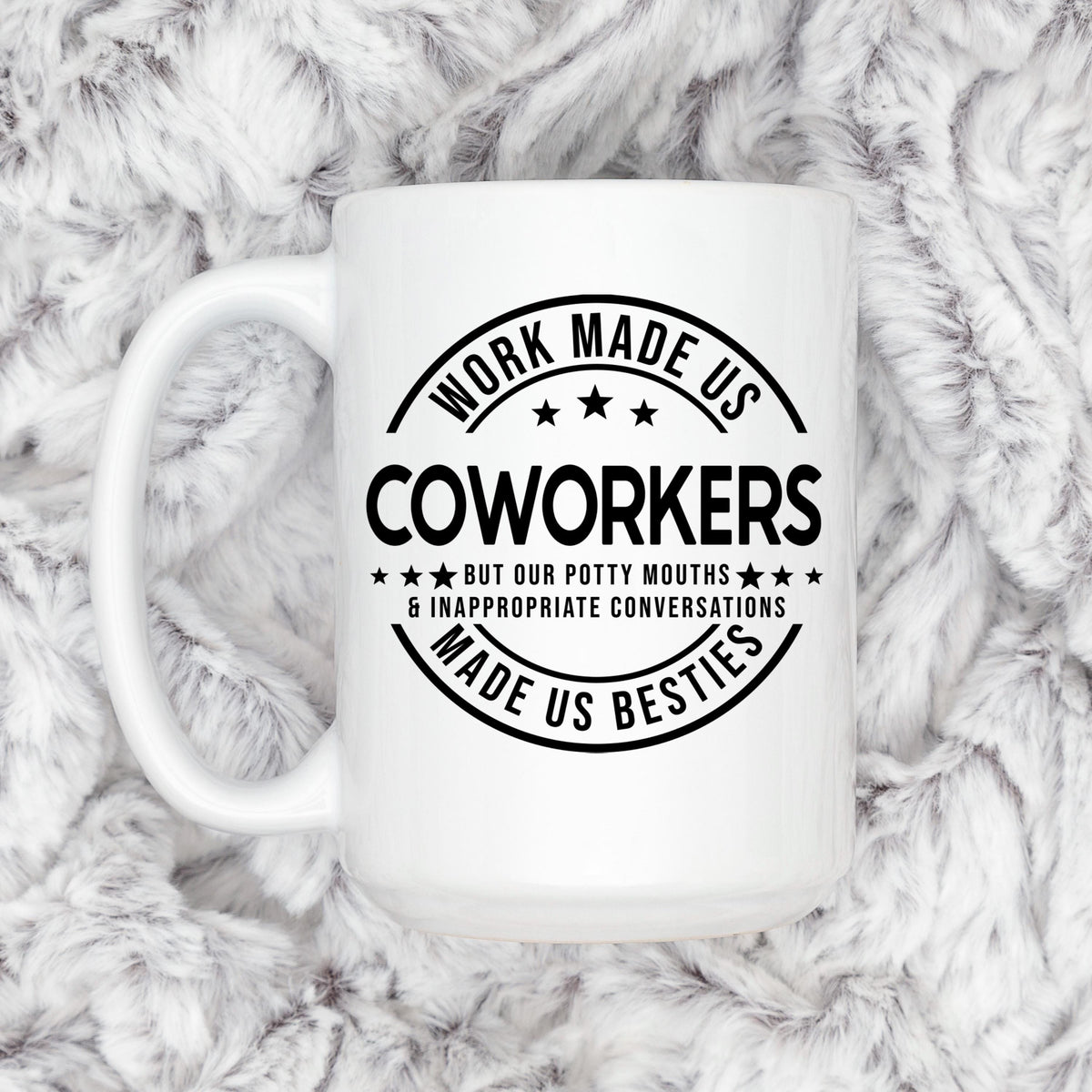 White ceramic mug with black coworker humor print and C-shaped side handle