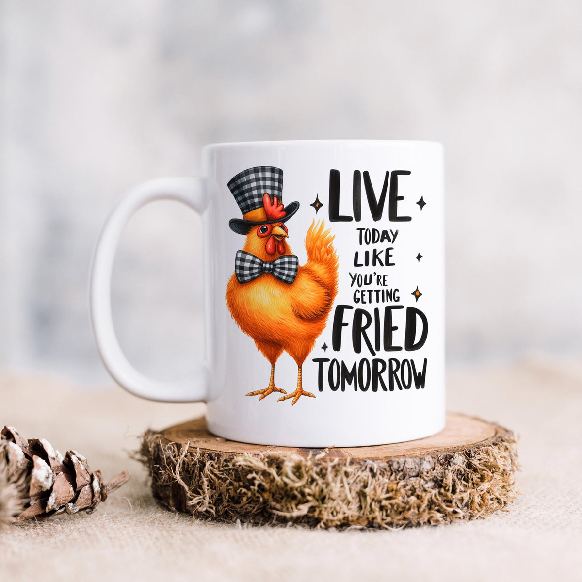 White ceramic mug with orange cartoon chicken and LIVE…FRIED TOMORROW slogan